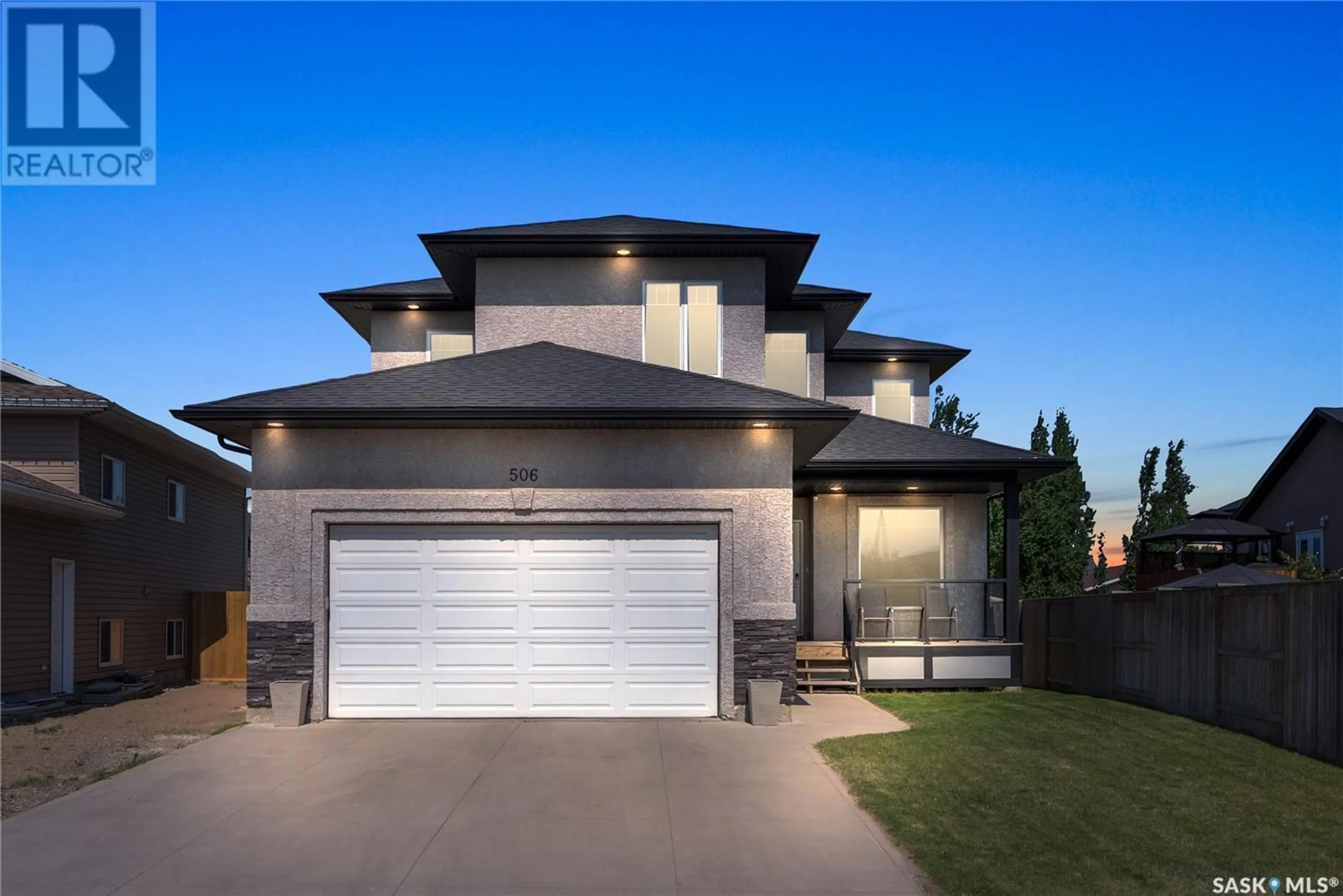Home with vinyl exterior material, street for 506 HAMPTON BOULEVARD, Saskatoon Saskatchewan S7R0C3