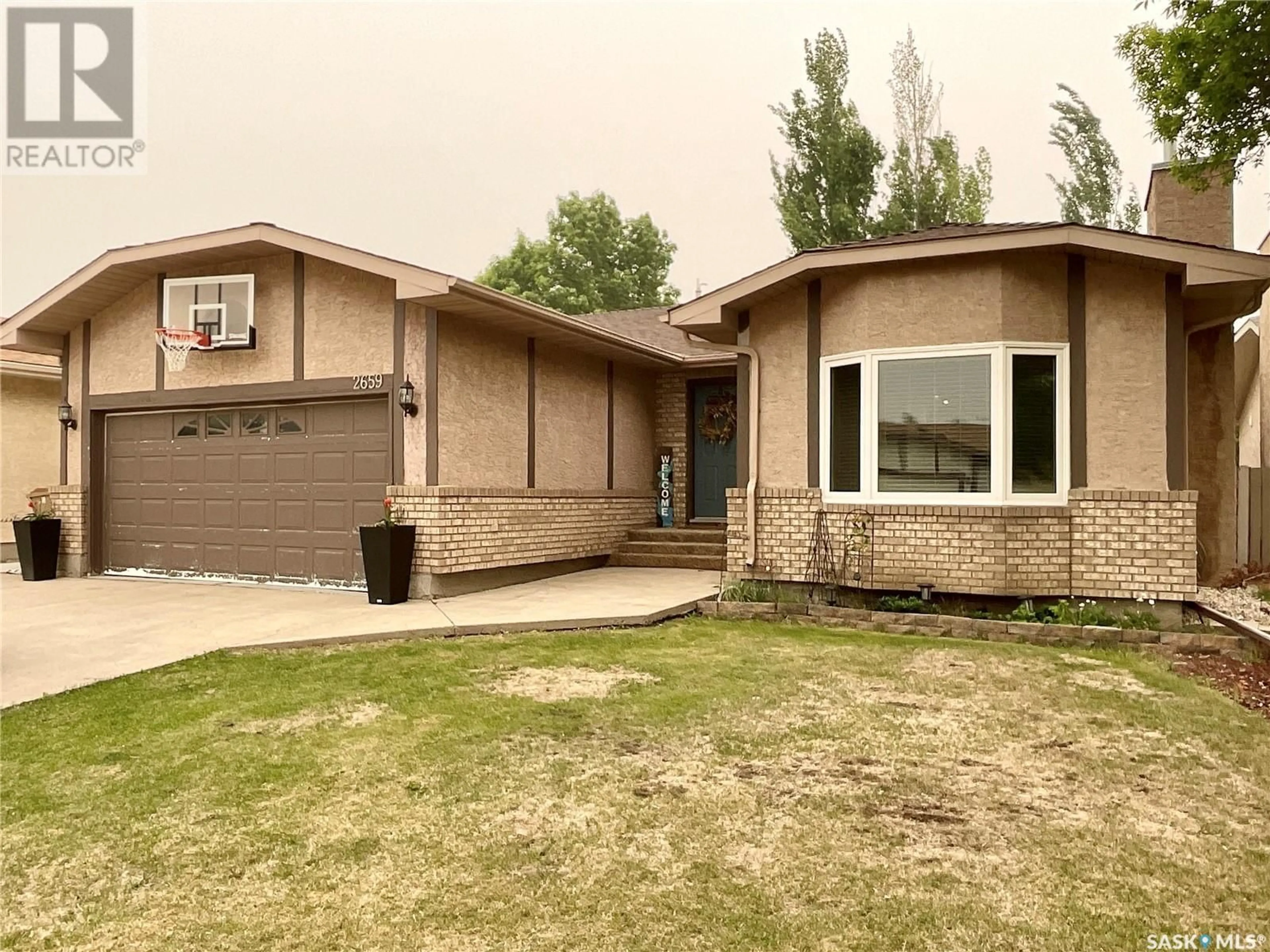 Home with vinyl exterior material, street for 2659 CROCUS DRIVE, Regina Saskatchewan S4V1T2