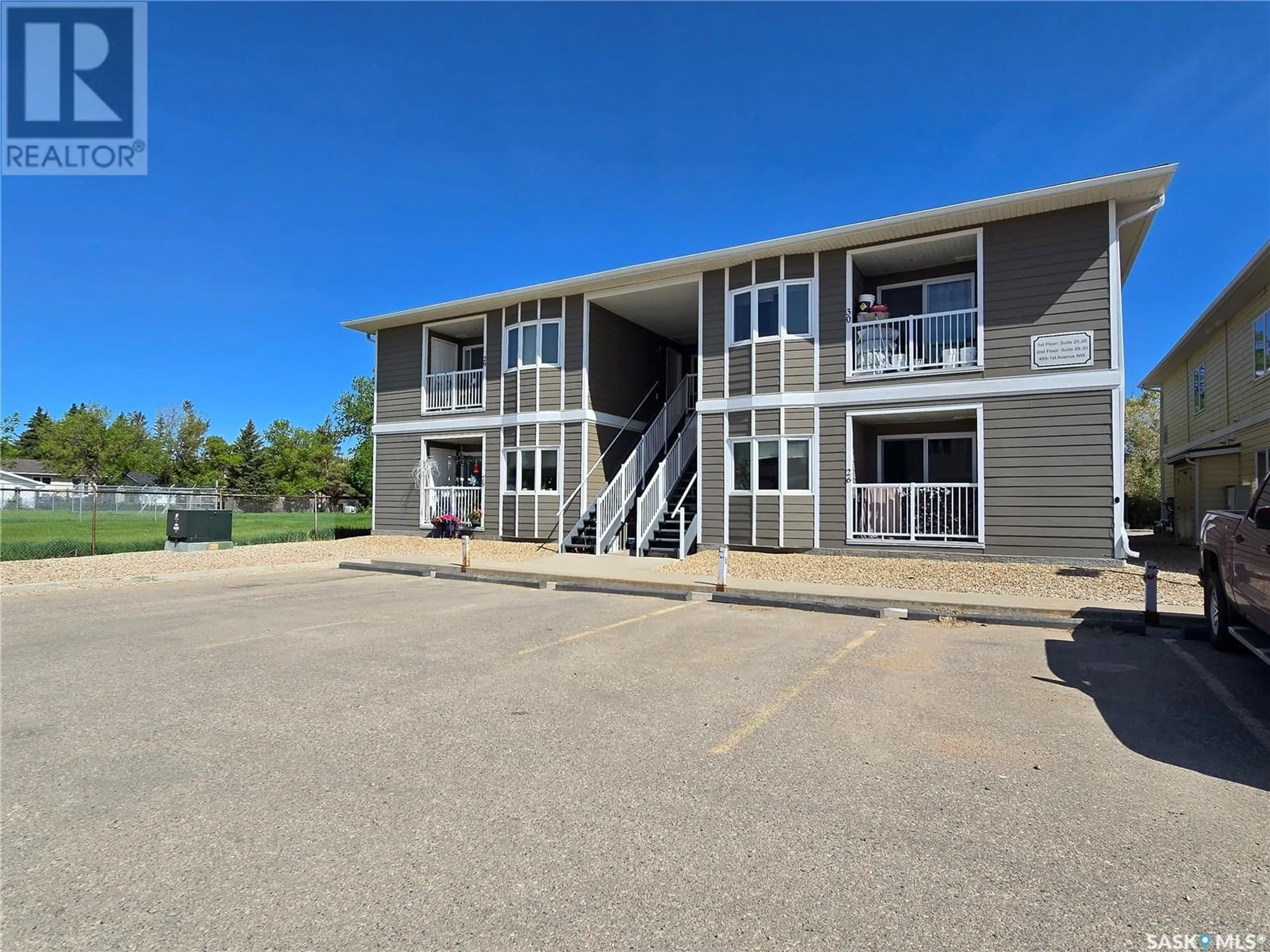 A pic from outside/outdoor area/front of a property/back of a property/a pic from drone, building for 26 - 485 1ST AVENUE NW, Weyburn Saskatchewan S4H1T1