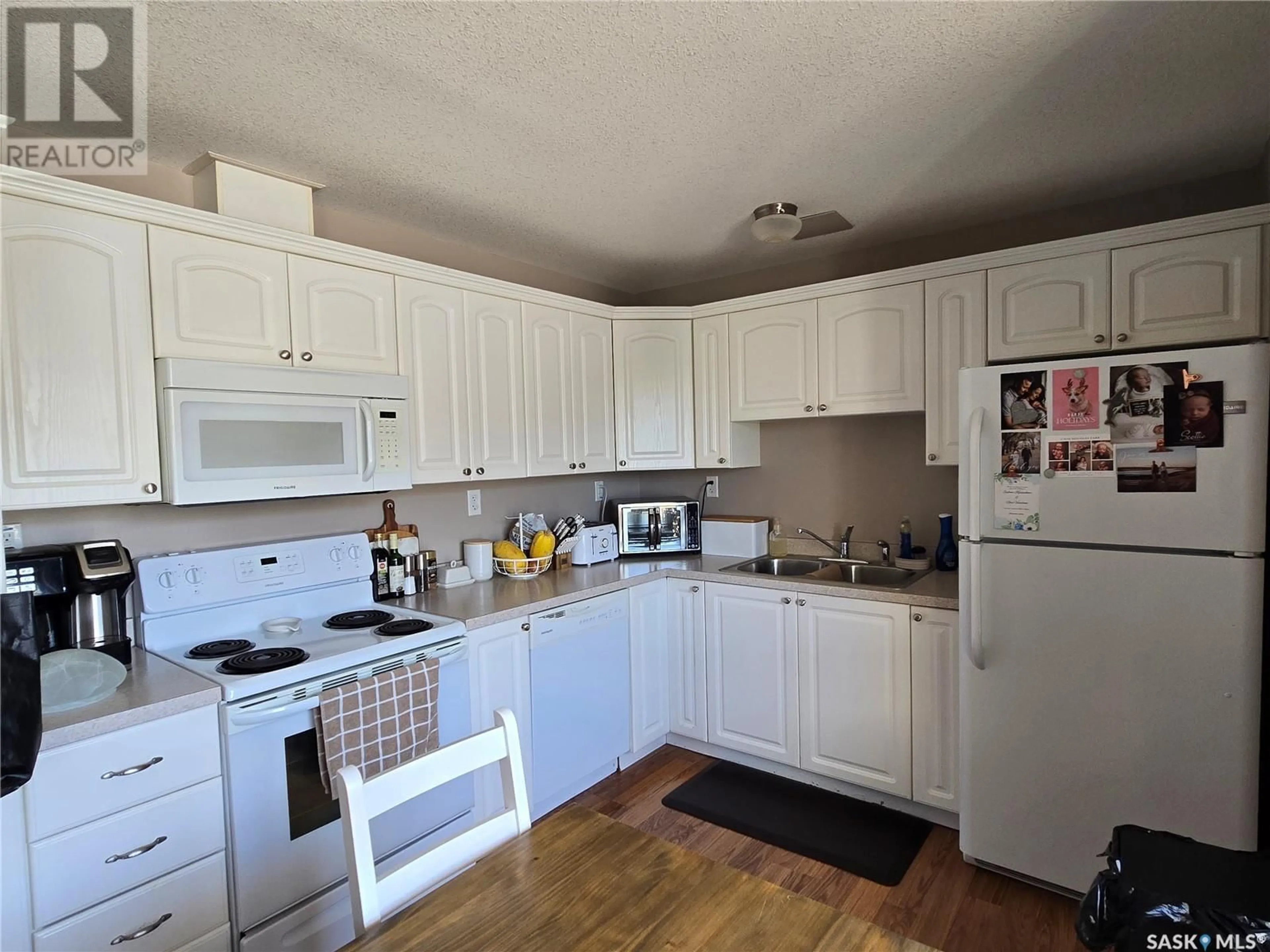 Standard kitchen, wood/laminate floor for 26 - 485 1ST AVENUE NW, Weyburn Saskatchewan S4H1T1