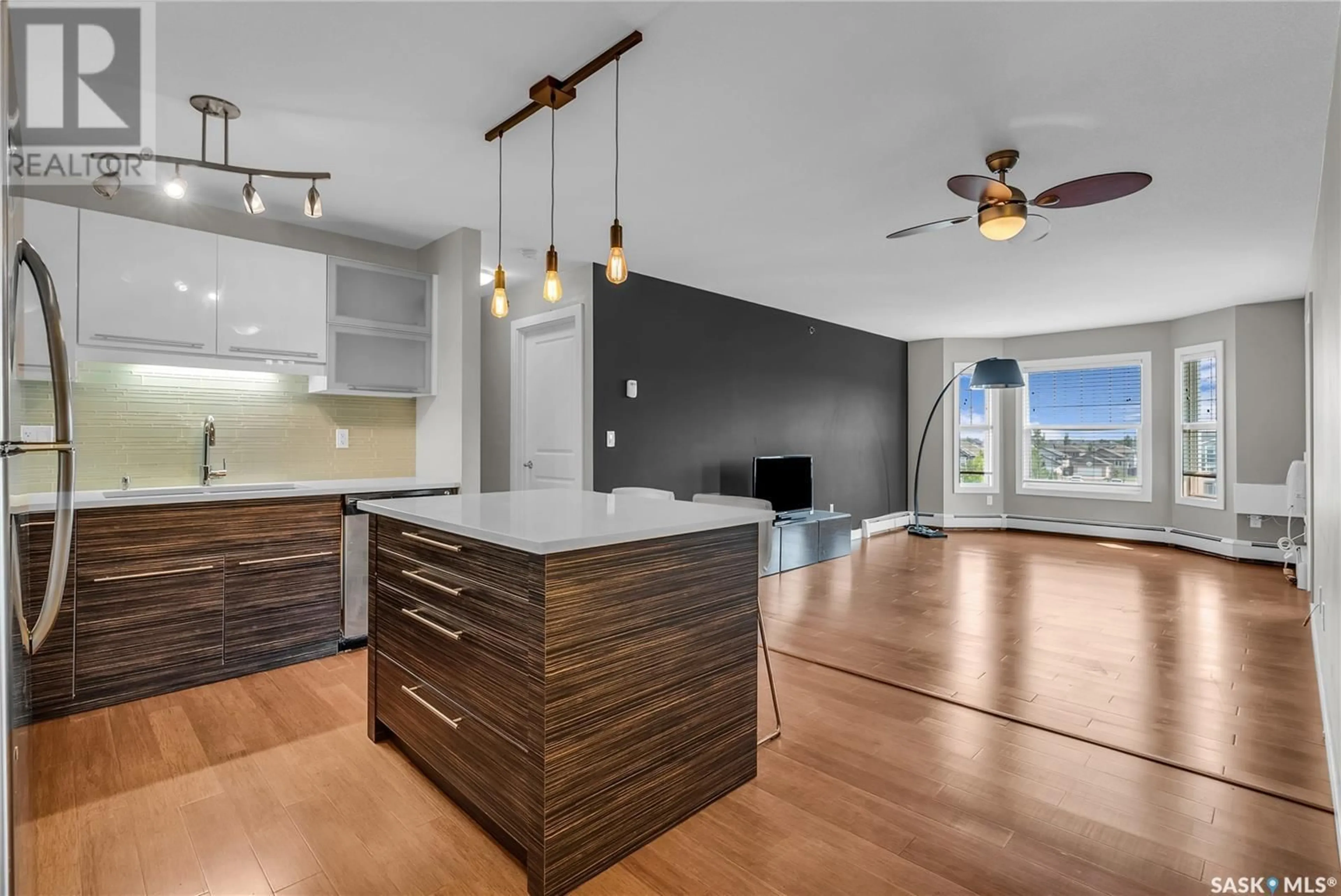 Open concept kitchen, wood/laminate floor for 305A HUNTER ROAD, Saskatoon Saskatchewan S7T0J7