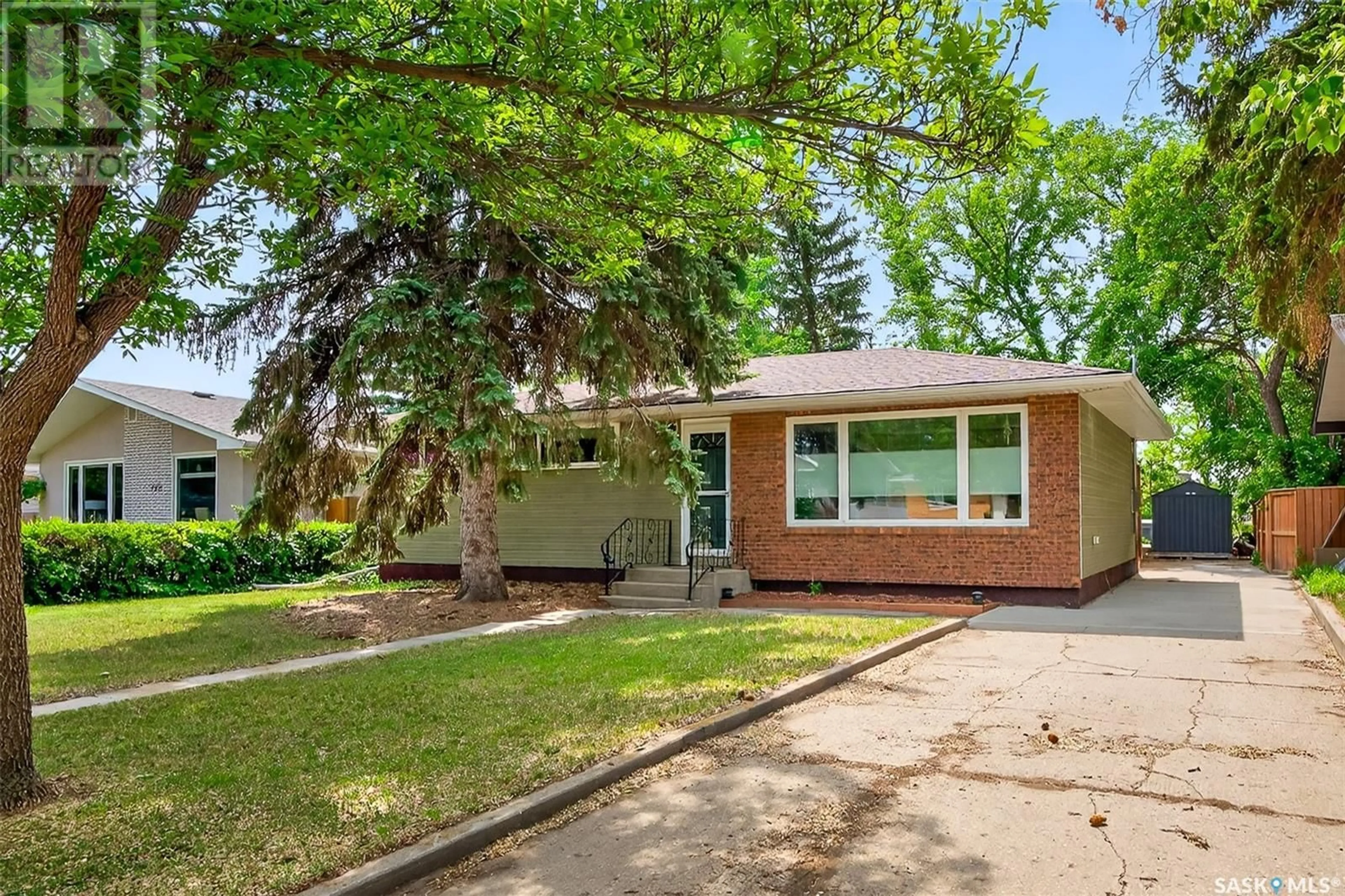 Home with brick exterior material, street for 1221 GRACE STREET, Moose Jaw Saskatchewan S6H3C6