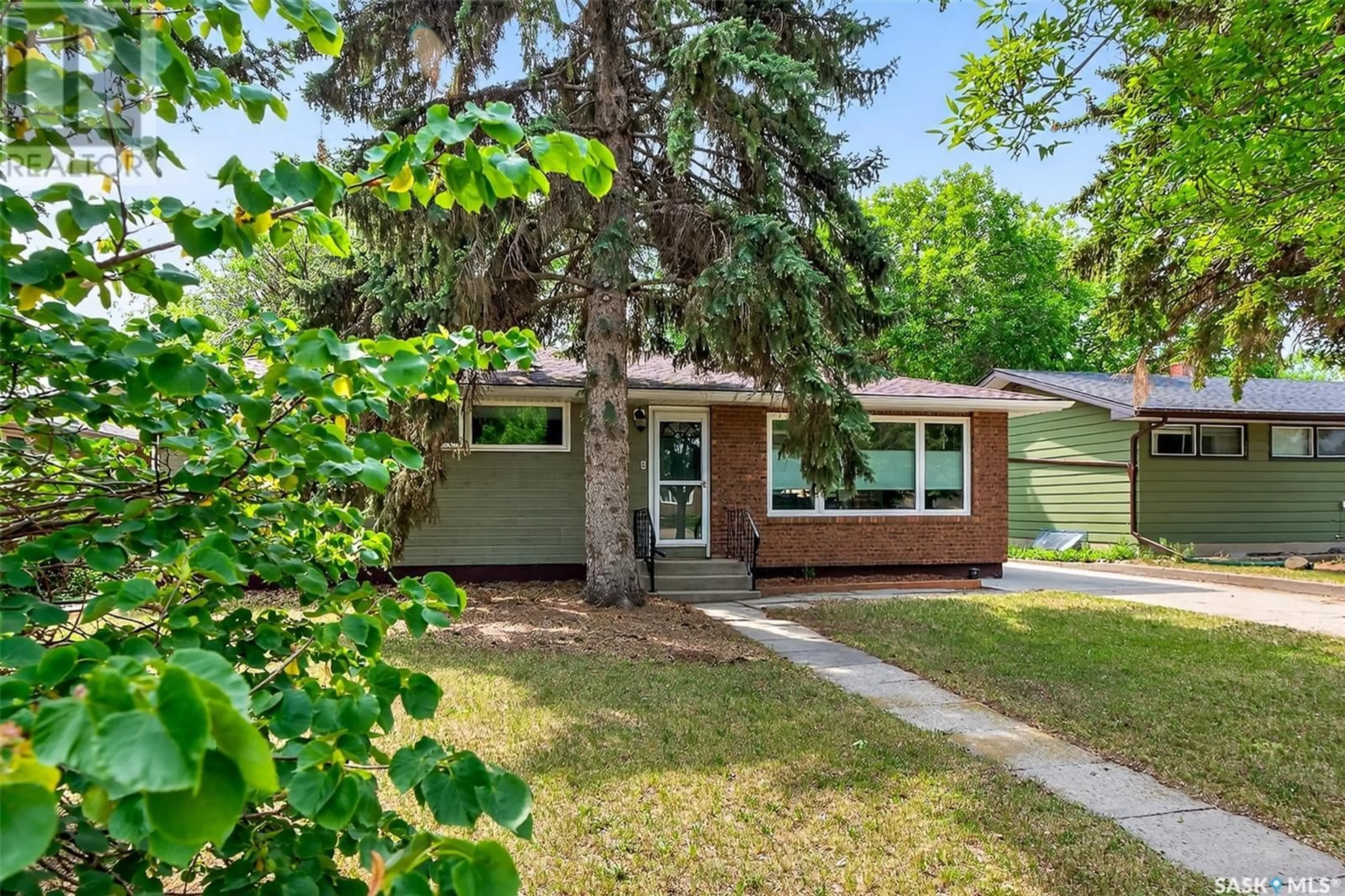 Home with vinyl exterior material, street for 1221 GRACE STREET, Moose Jaw Saskatchewan S6H3C6