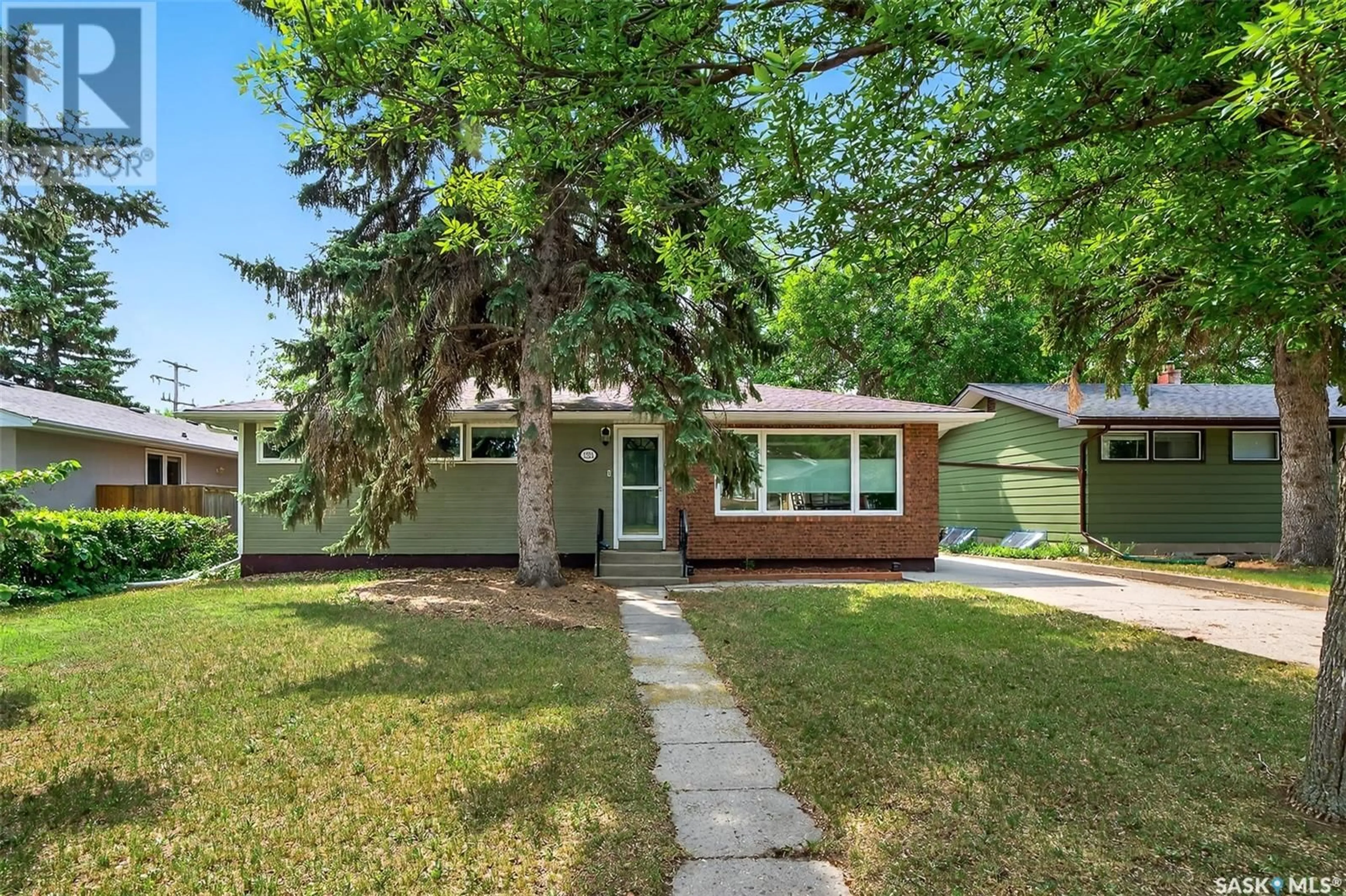 Home with vinyl exterior material, street for 1221 GRACE STREET, Moose Jaw Saskatchewan S6H3C6