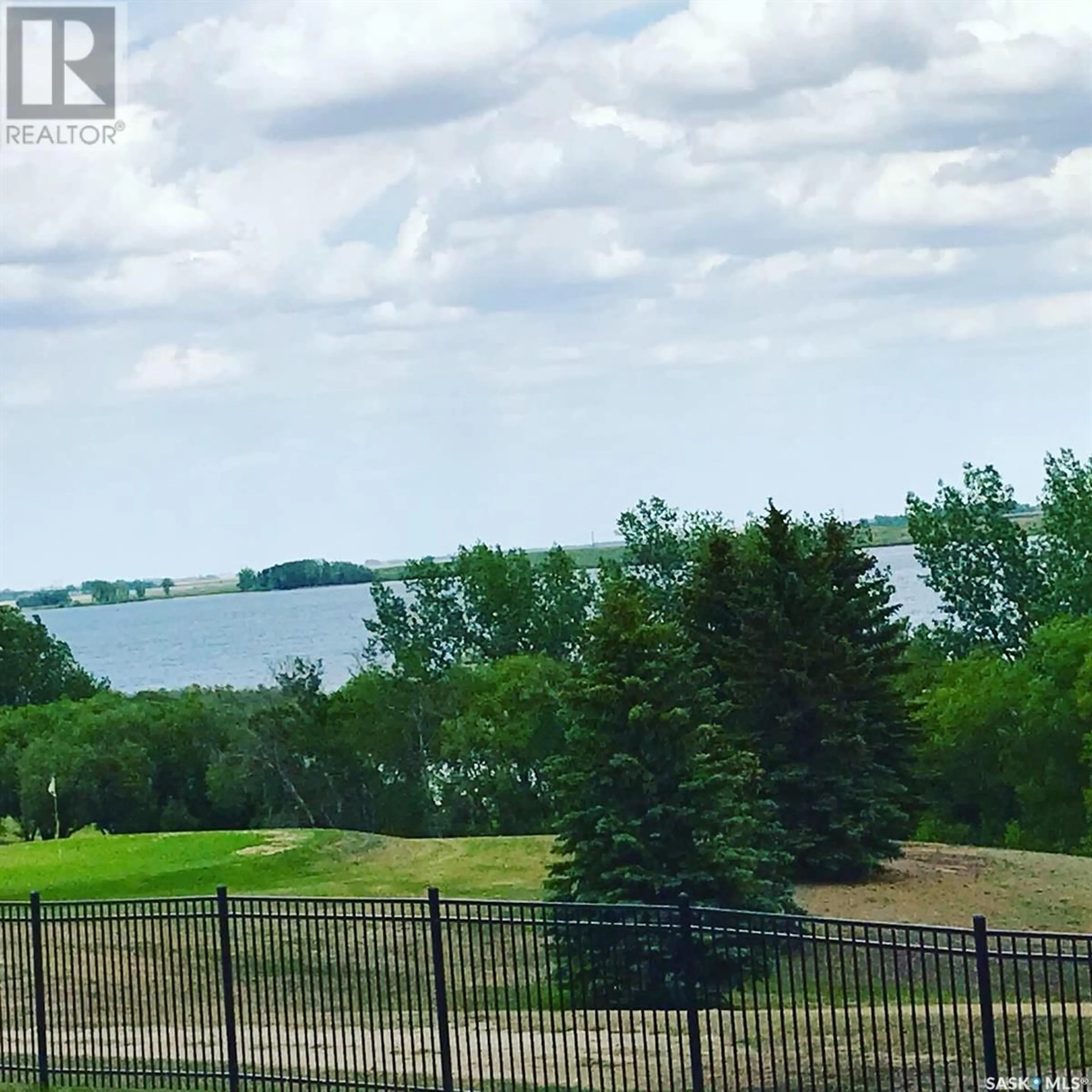 A pic from outside/outdoor area/front of a property/back of a property/a pic from drone, water/lake/river/ocean view for 16 SUNTERRA DRIVE, Shields Saskatchewan S7C0A3
