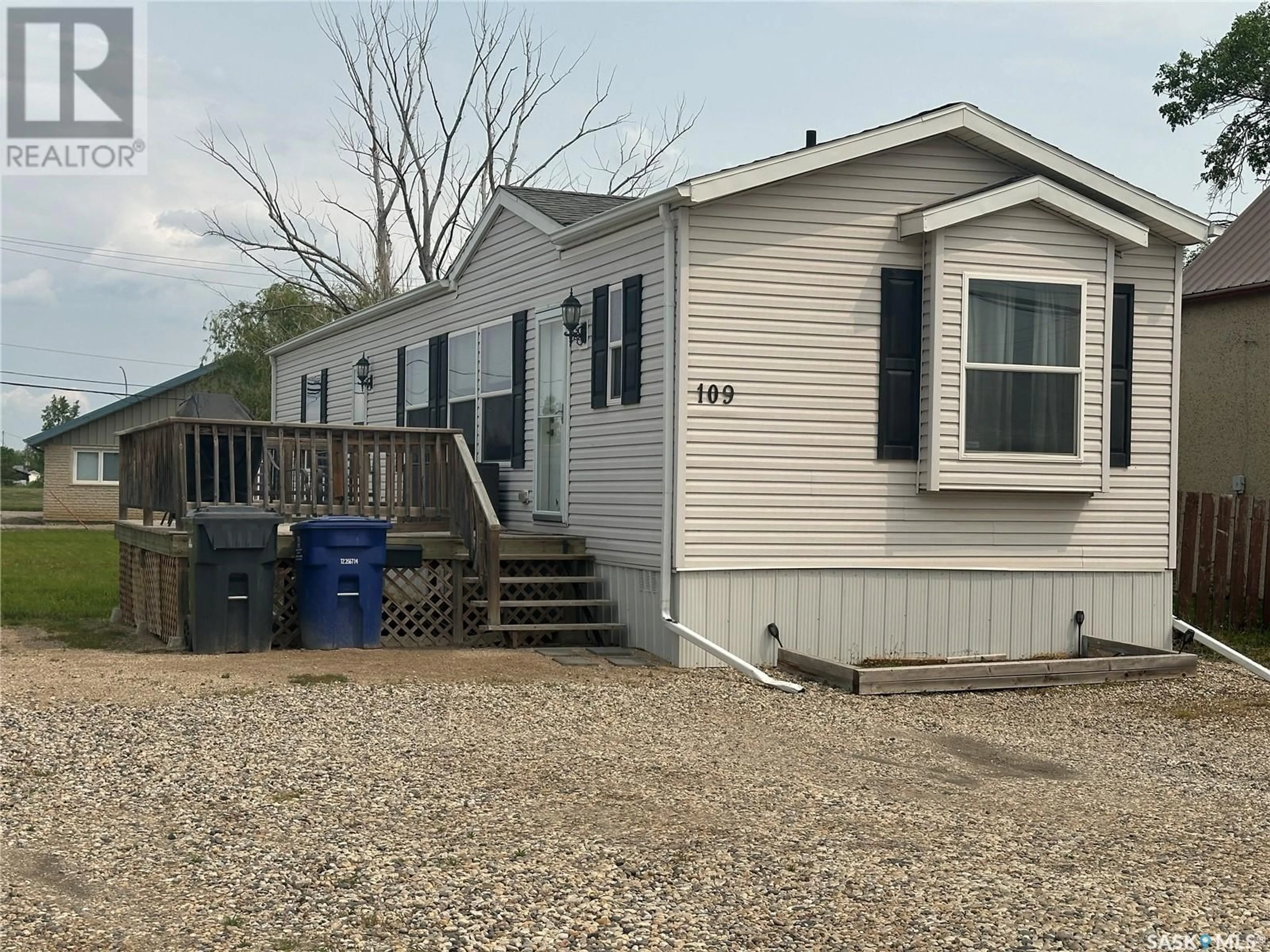 Home with vinyl exterior material, street for 109 1ST AVENUE, Weyburn Saskatchewan S4H2H9