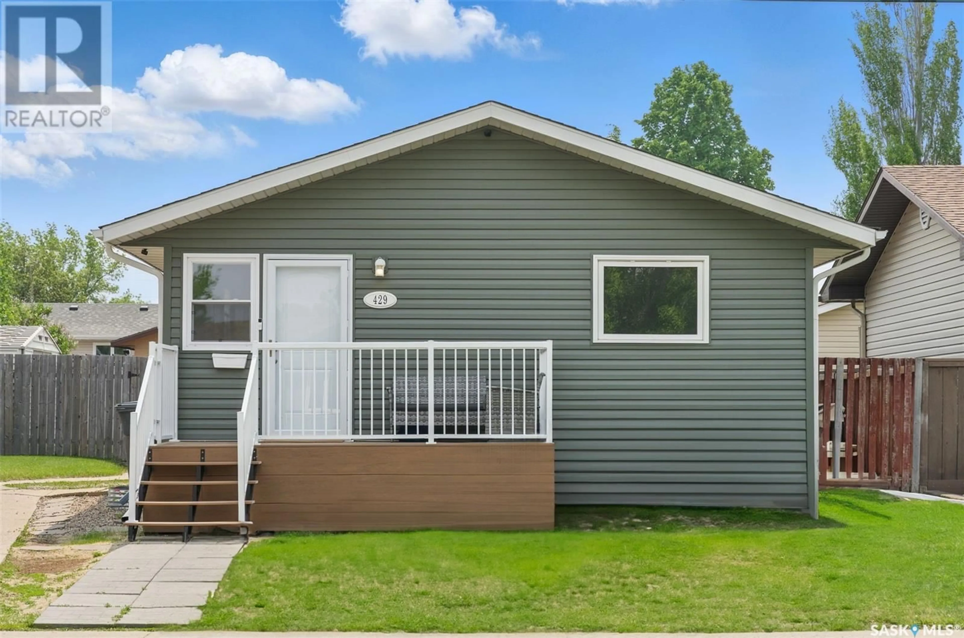 Home with vinyl exterior material, street for 429 LANGEVIN CRESCENT, Saskatoon Saskatchewan S7L5R5