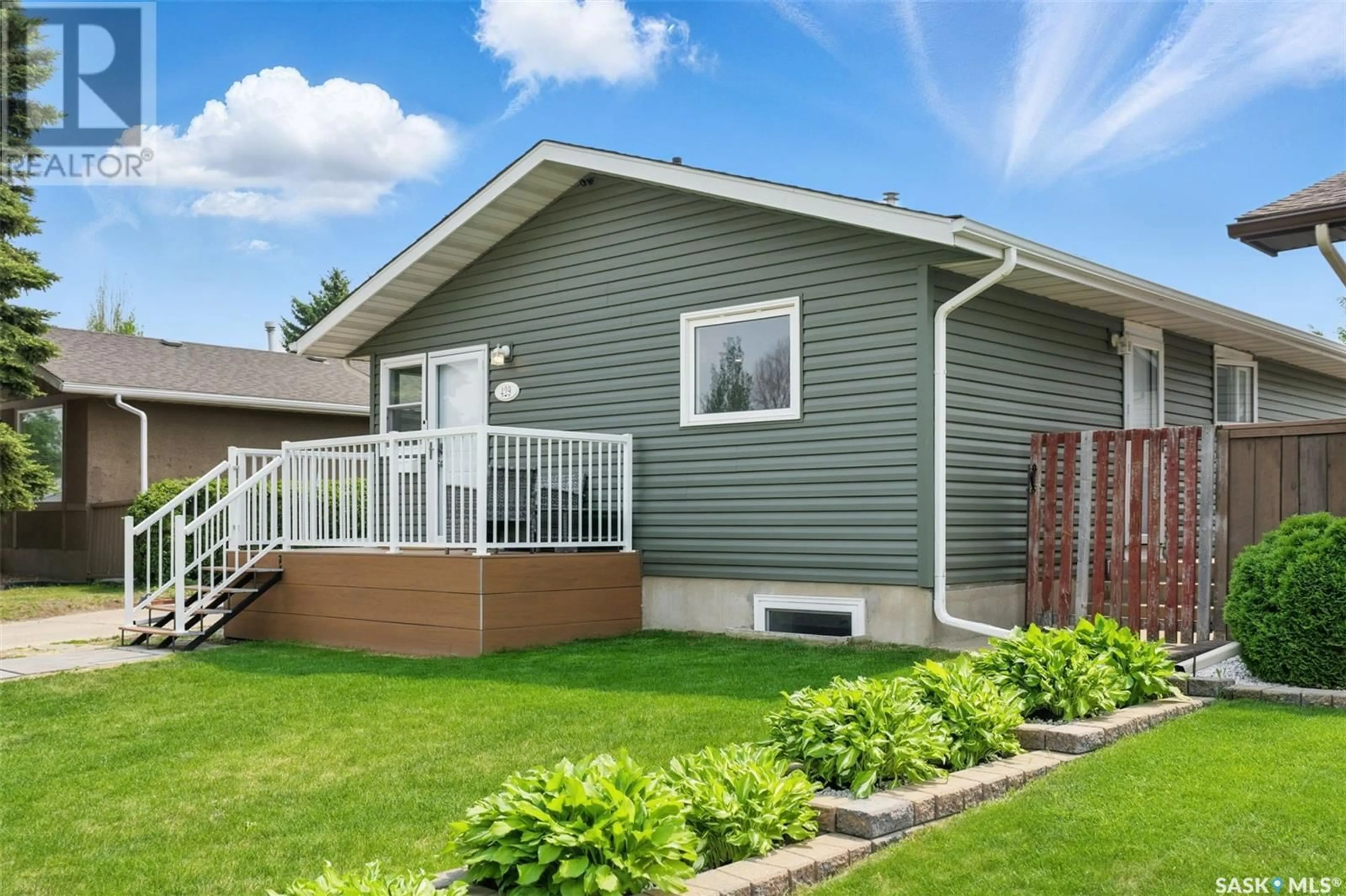 Home with vinyl exterior material, street for 429 LANGEVIN CRESCENT, Saskatoon Saskatchewan S7L5R5