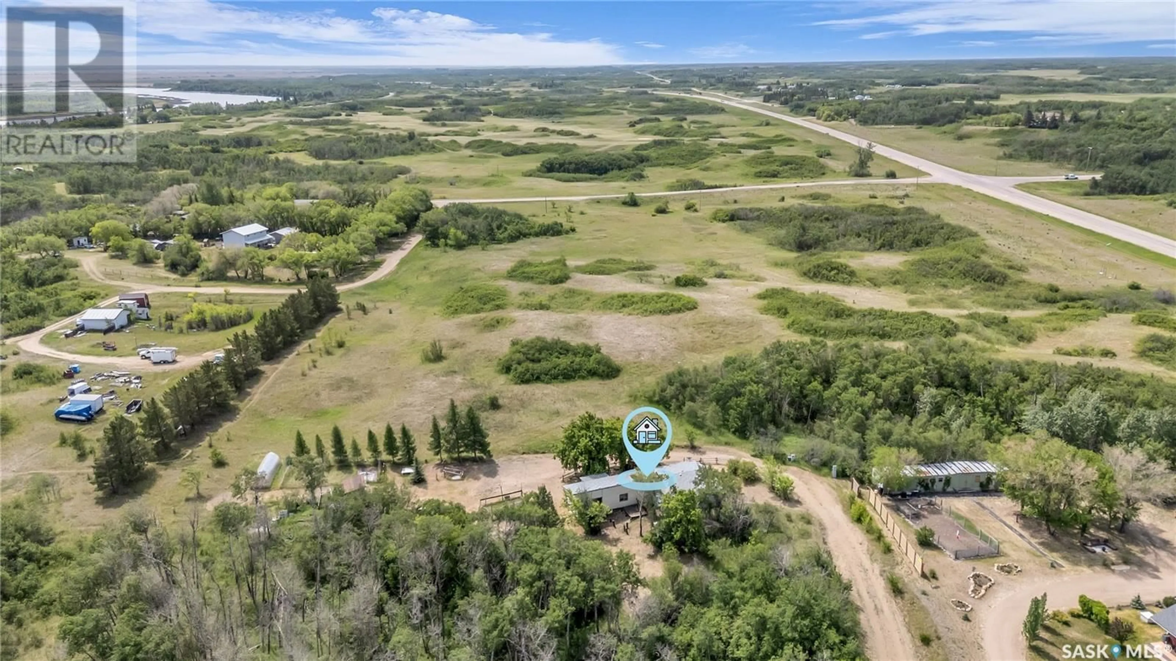 A pic from outside/outdoor area/front of a property/back of a property/a pic from drone, water/lake/river/ocean view for PIKE LAKE ACREAGE, Vanscoy Rm No. 345 Saskatchewan S0L3J0