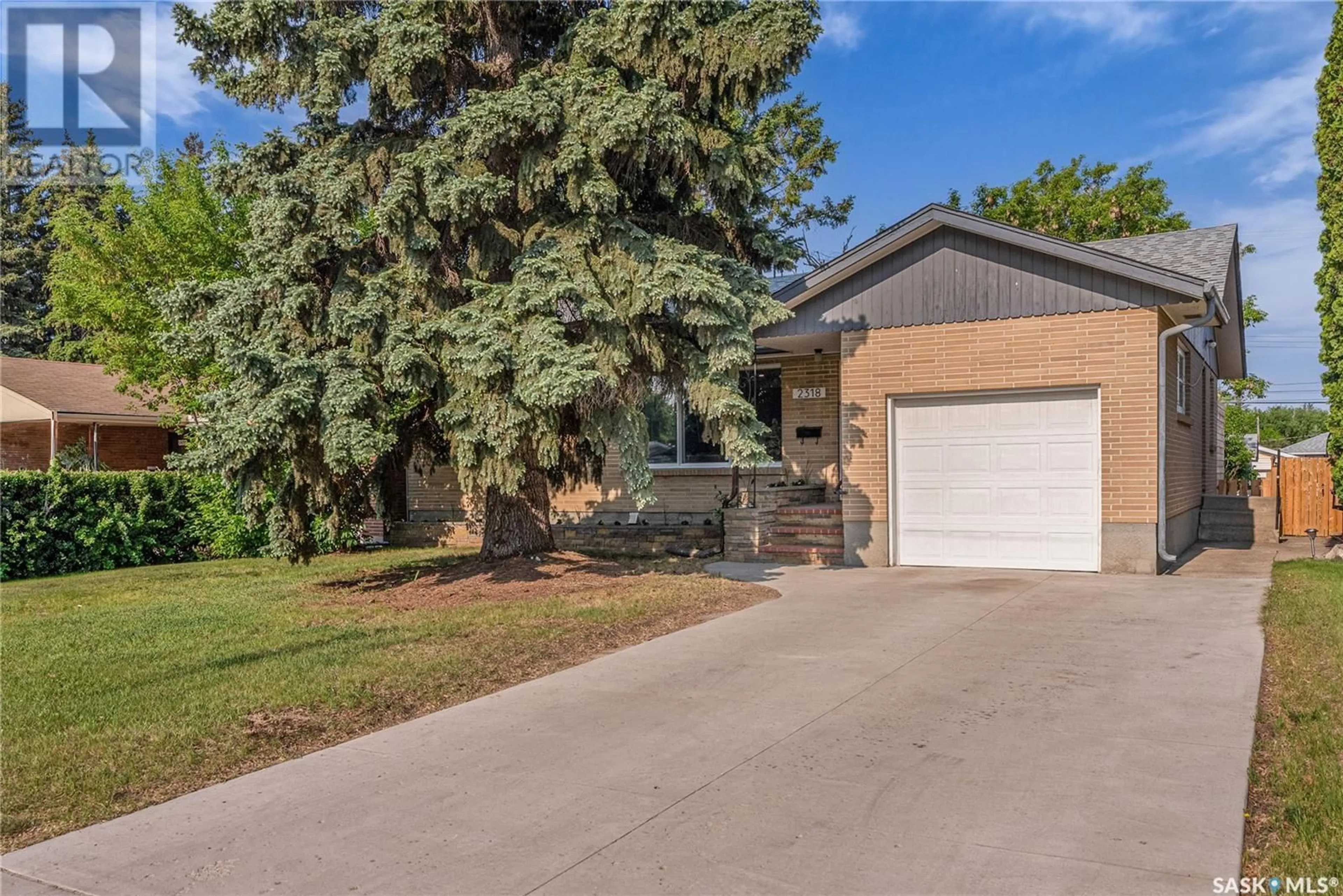 Home with brick exterior material, street for 2318 CLARENCE AVENUE, Saskatoon Saskatchewan S7J1L9