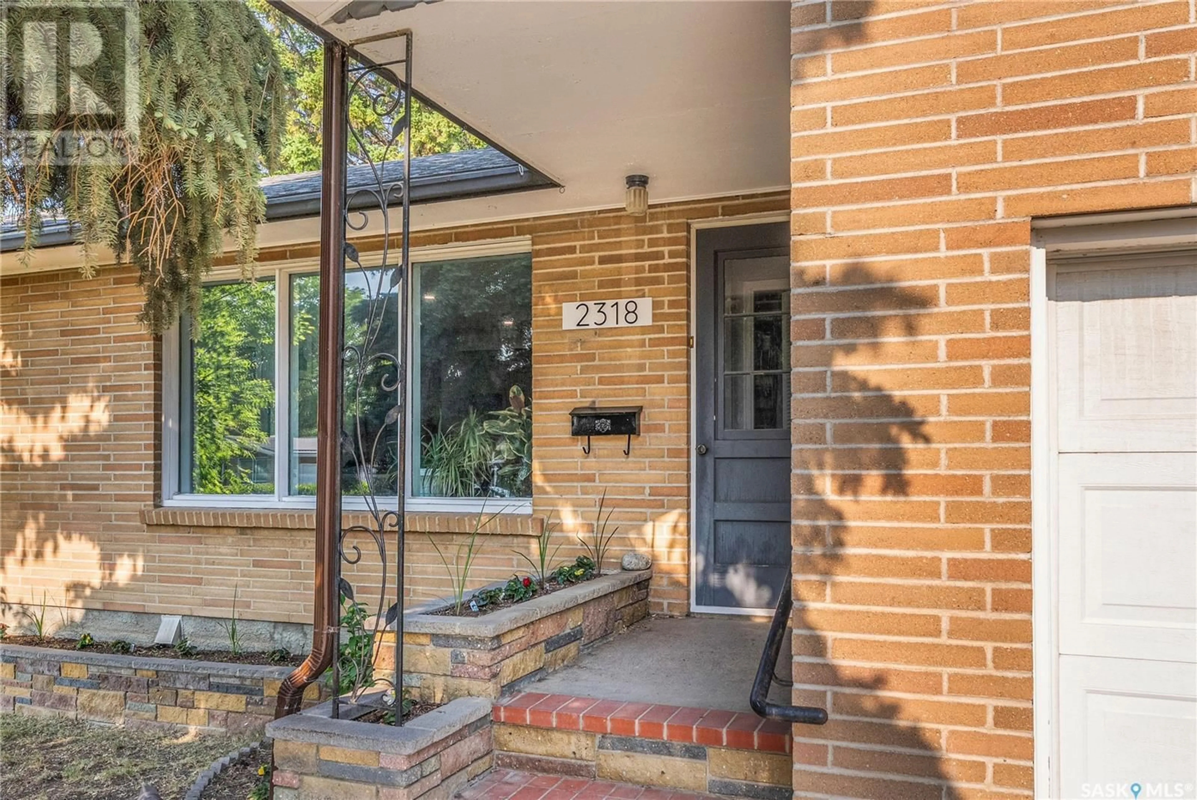 Home with brick exterior material, street for 2318 CLARENCE AVENUE, Saskatoon Saskatchewan S7J1L9