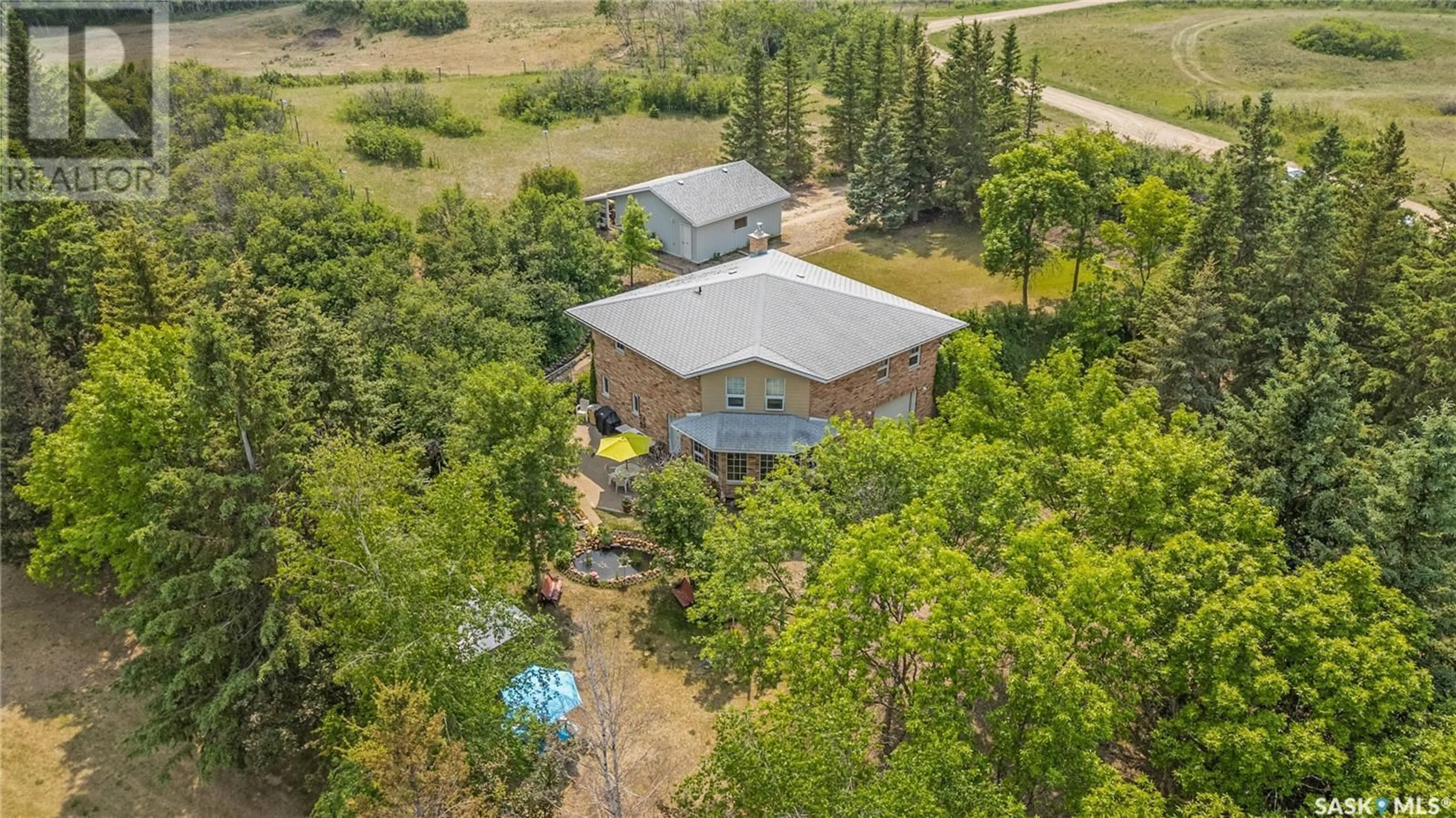 A pic from outside/outdoor area/front of a property/back of a property/a pic from drone, unknown for STUGLIN ACREAGE, Vanscoy Rm No. 345 Saskatchewan S7K1N2