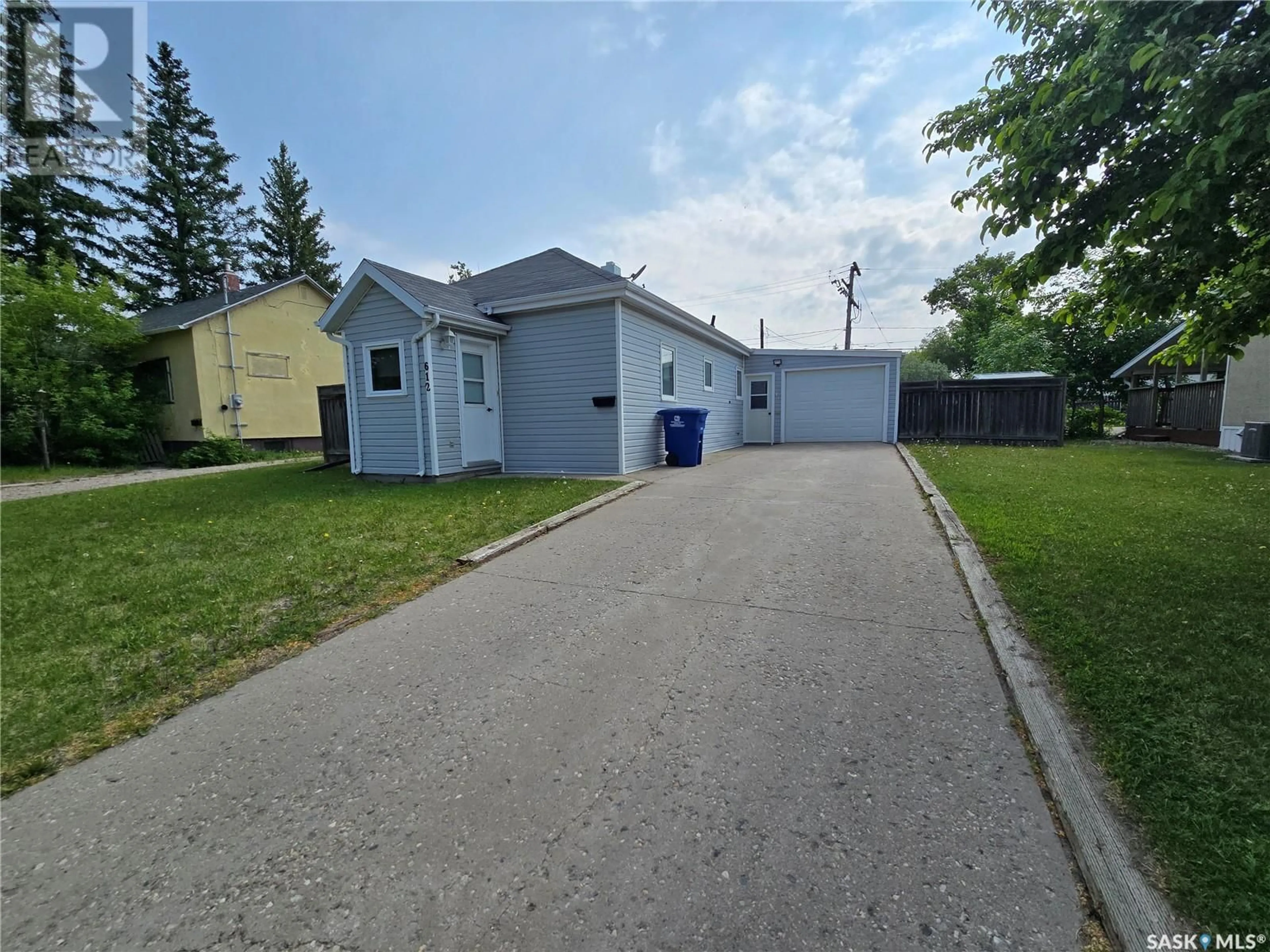 A pic from outside/outdoor area/front of a property/back of a property/a pic from drone, street for 612 3RD STREET, Weyburn Saskatchewan S4H2E1