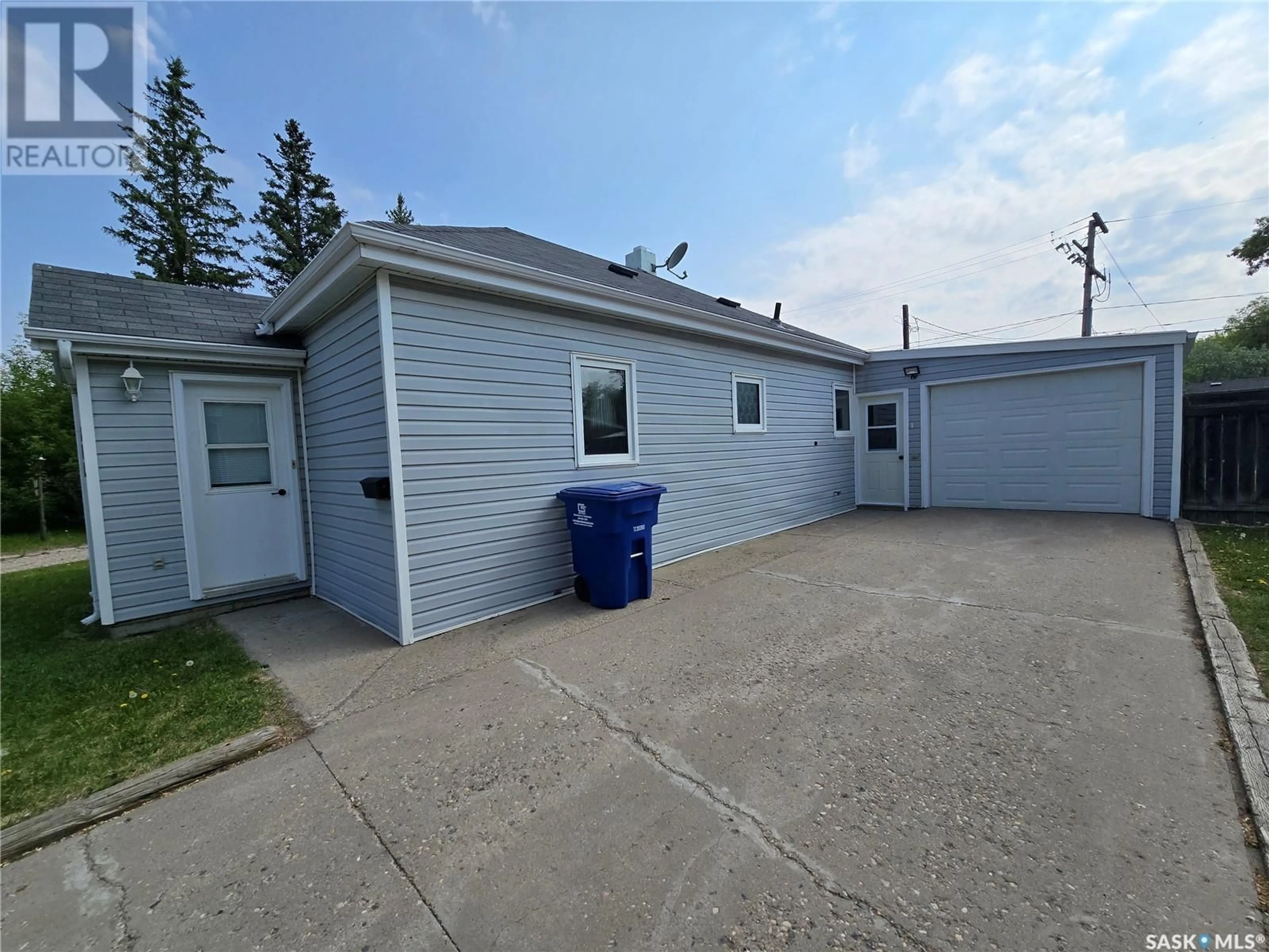 A pic from outside/outdoor area/front of a property/back of a property/a pic from drone, street for 612 3RD STREET, Weyburn Saskatchewan S4H2E1