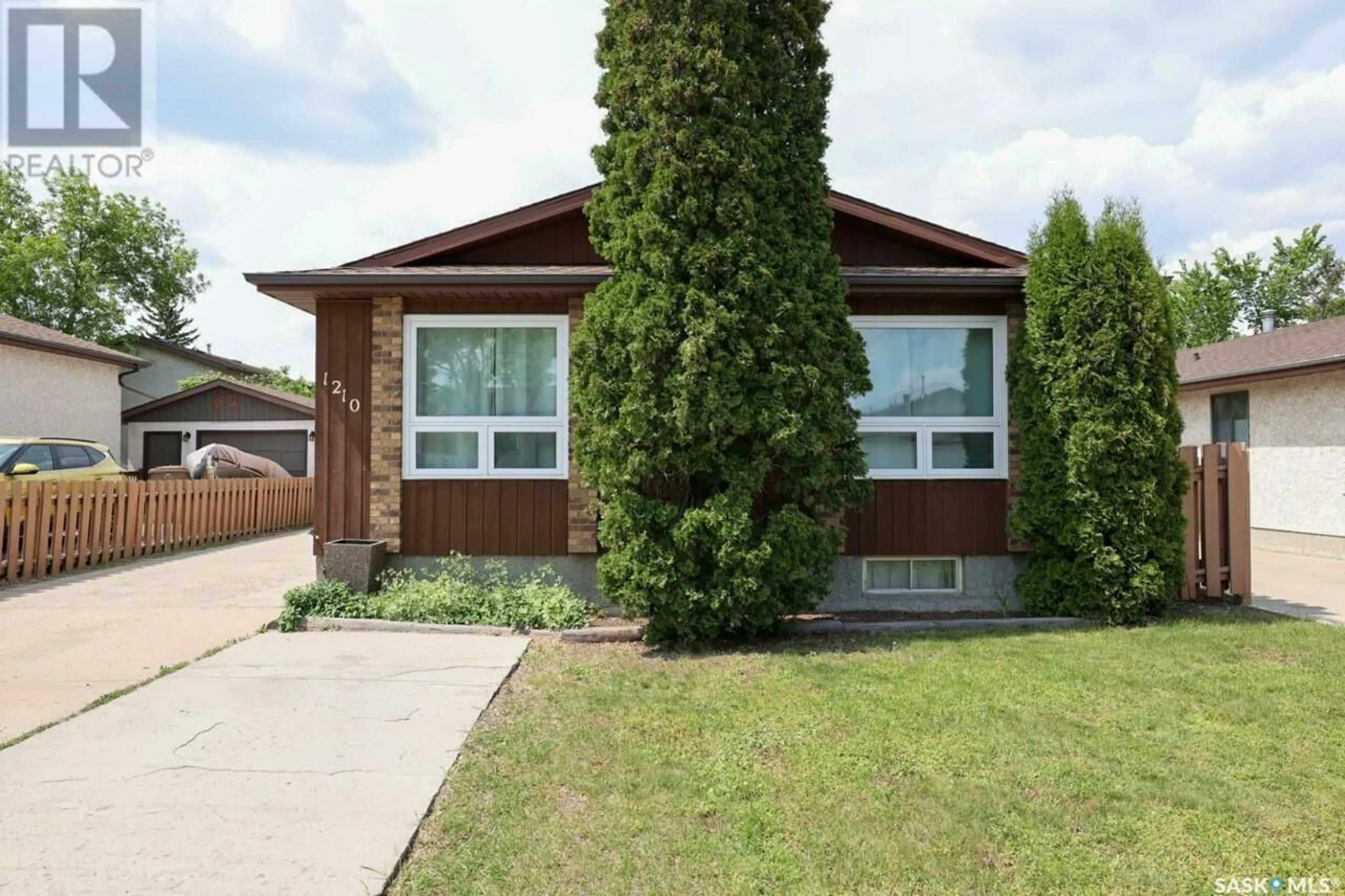 Home with brick exterior material, street for 1210 GRAHAM ROAD, Regina Saskatchewan S4N6W7
