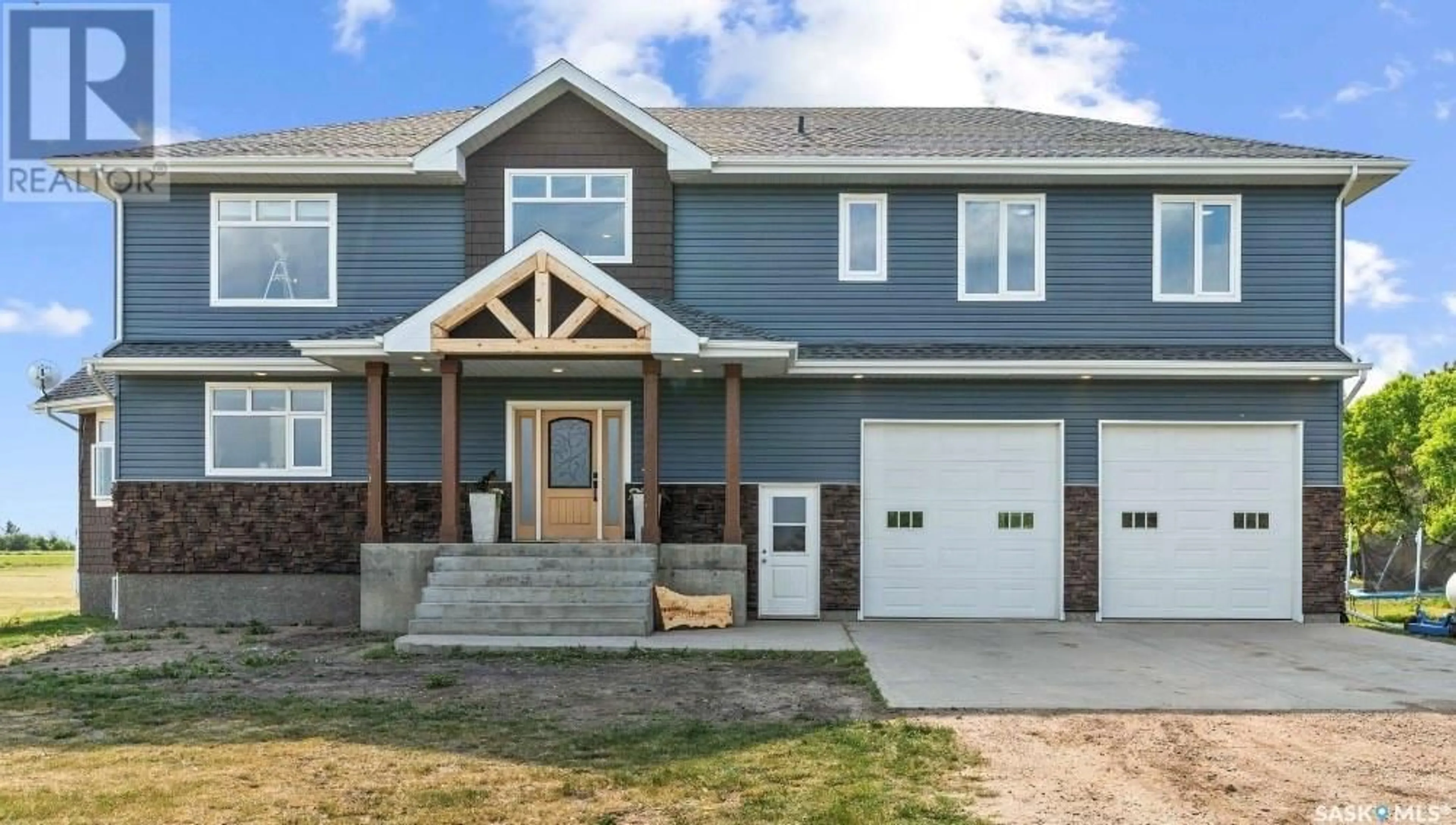 Home with vinyl exterior material, street for LAMONT ACREAGE, Wreford Rm No. 280 Saskatchewan S0G2J0