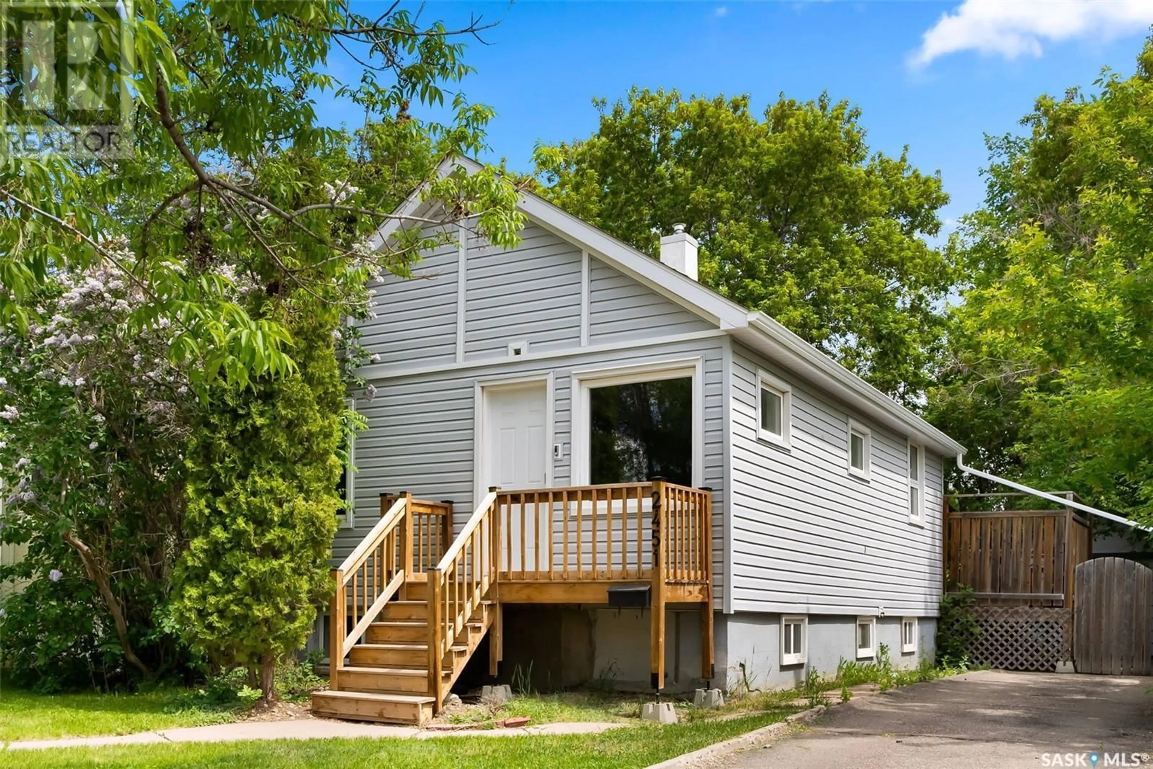 Home with vinyl exterior material, street for 2451 REYNOLDS STREET, Regina Saskatchewan S4P3A2