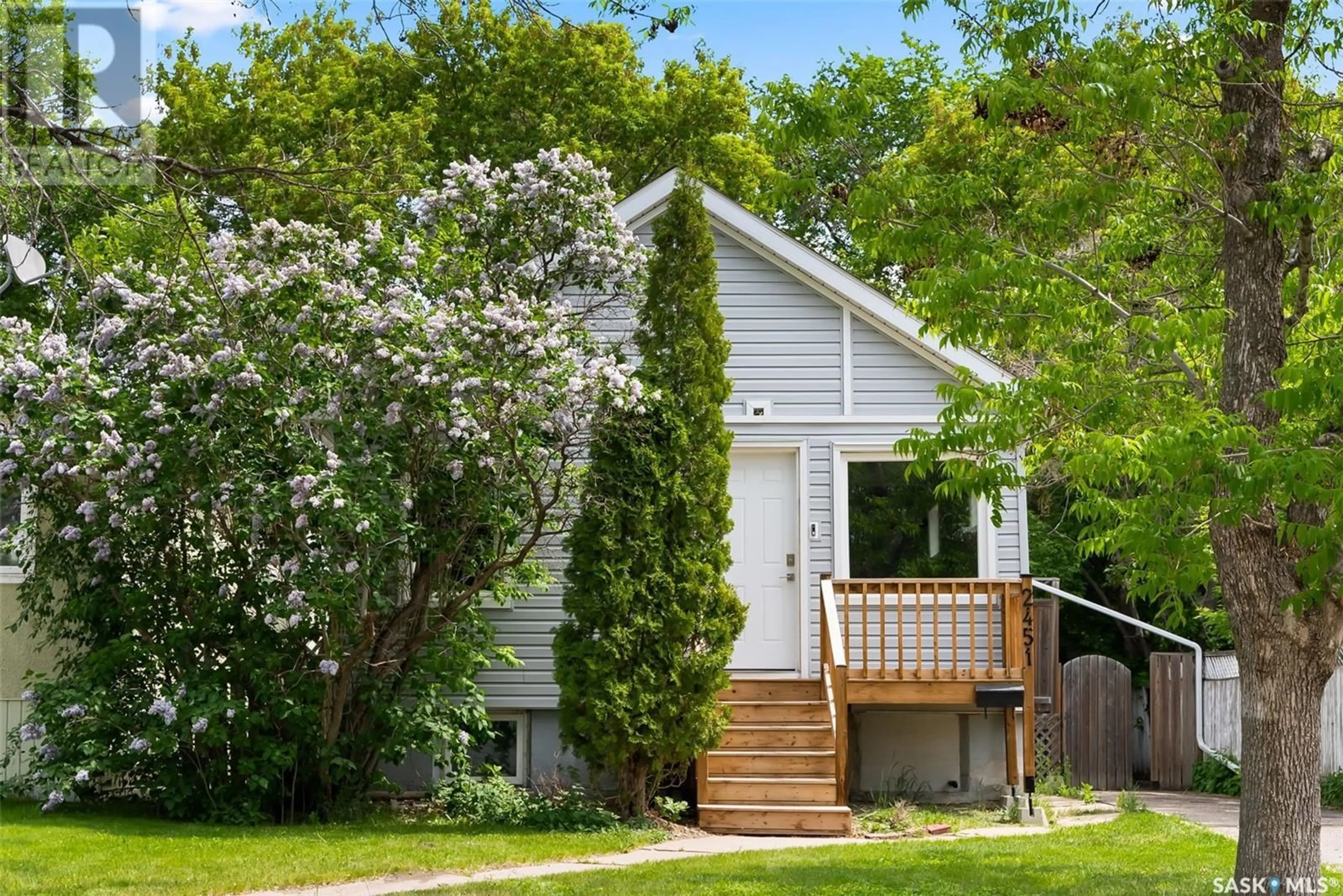 Home with vinyl exterior material, street for 2451 REYNOLDS STREET, Regina Saskatchewan S4P3A2