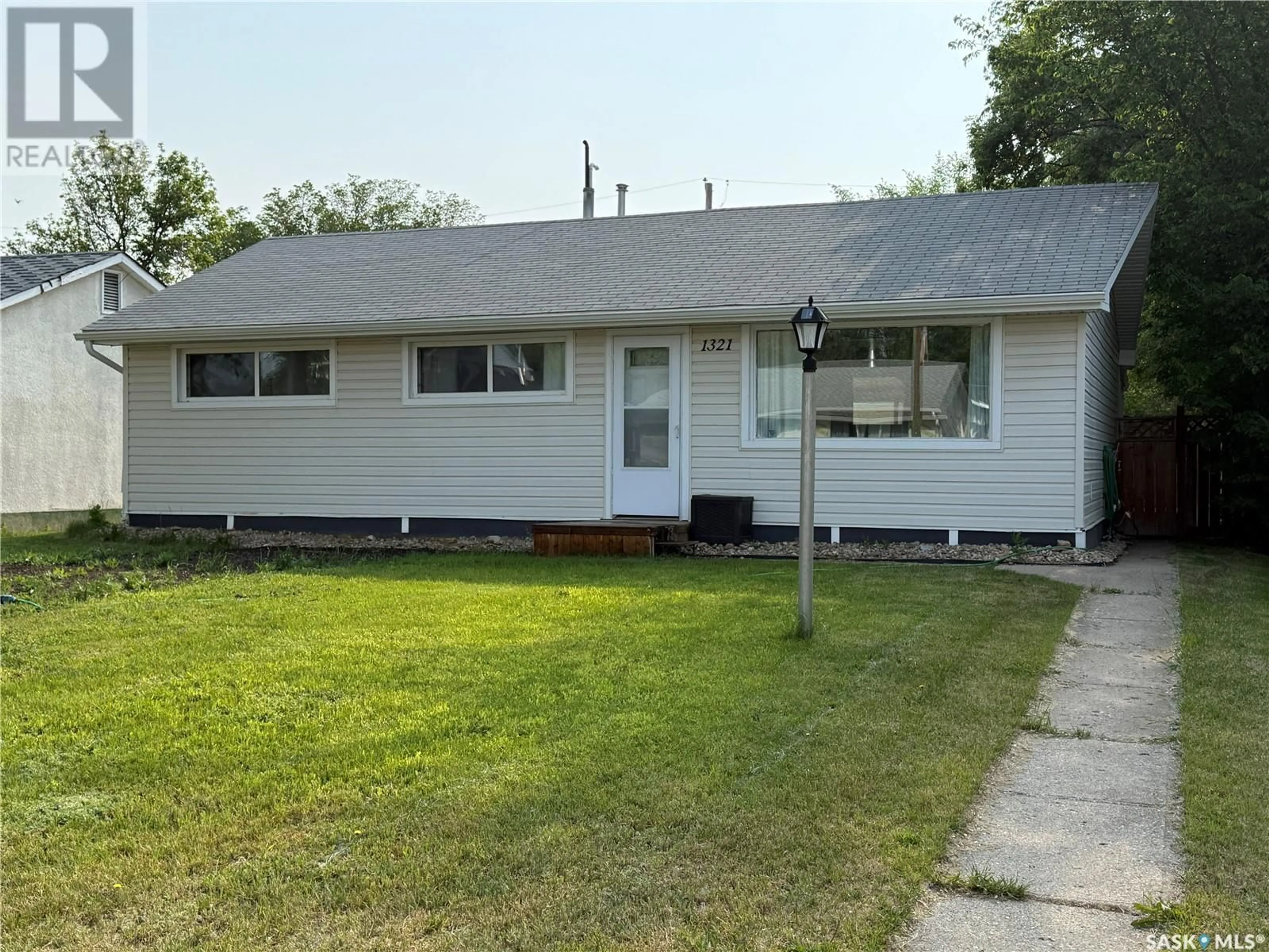 Home with vinyl exterior material, street for 1321 CONNAUGHT AVENUE, Moose Jaw Saskatchewan S6H4B9