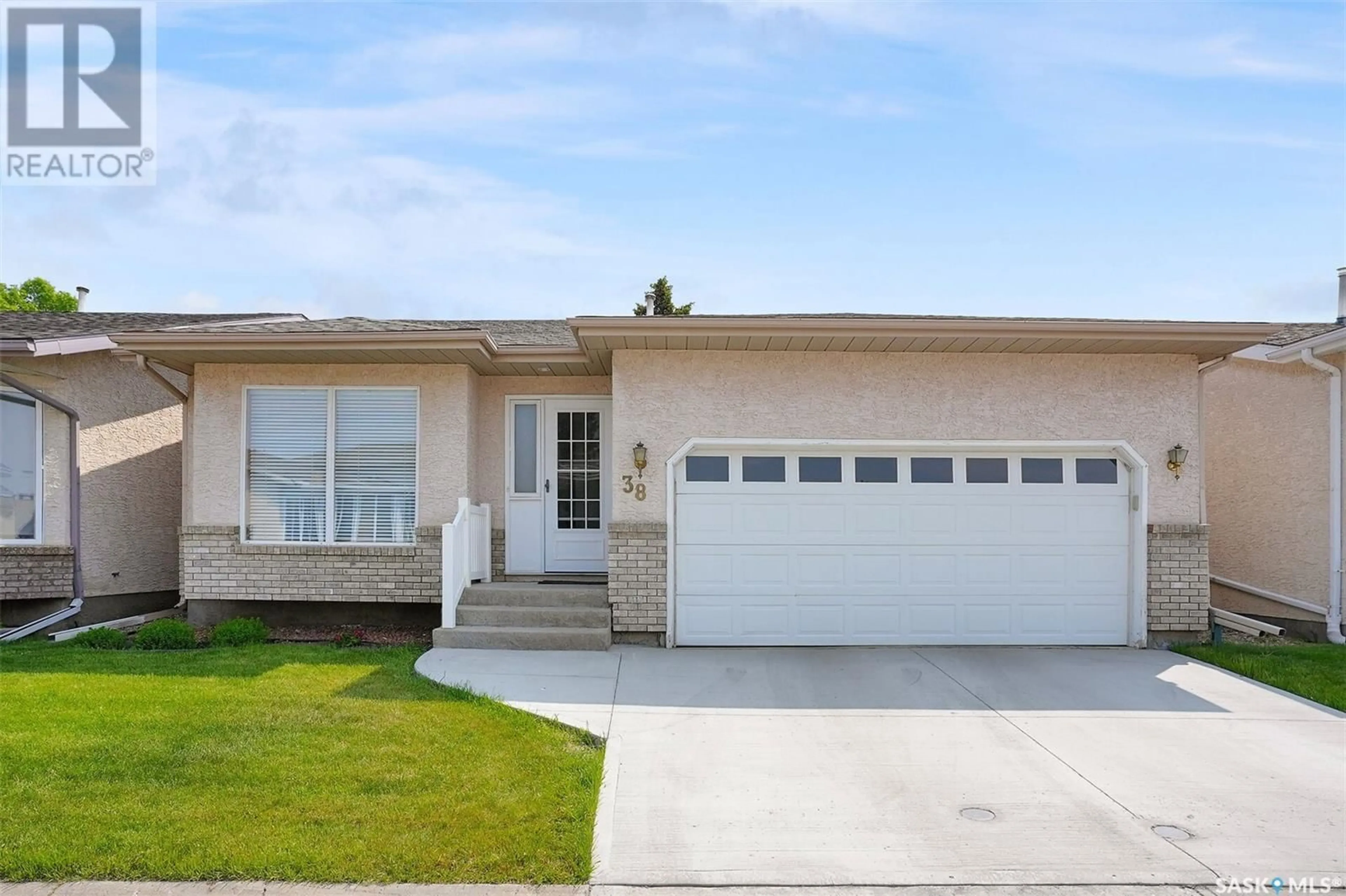 Home with vinyl exterior material, street for 38 GREENSBORO DRIVE, Regina Saskatchewan S4S7G1