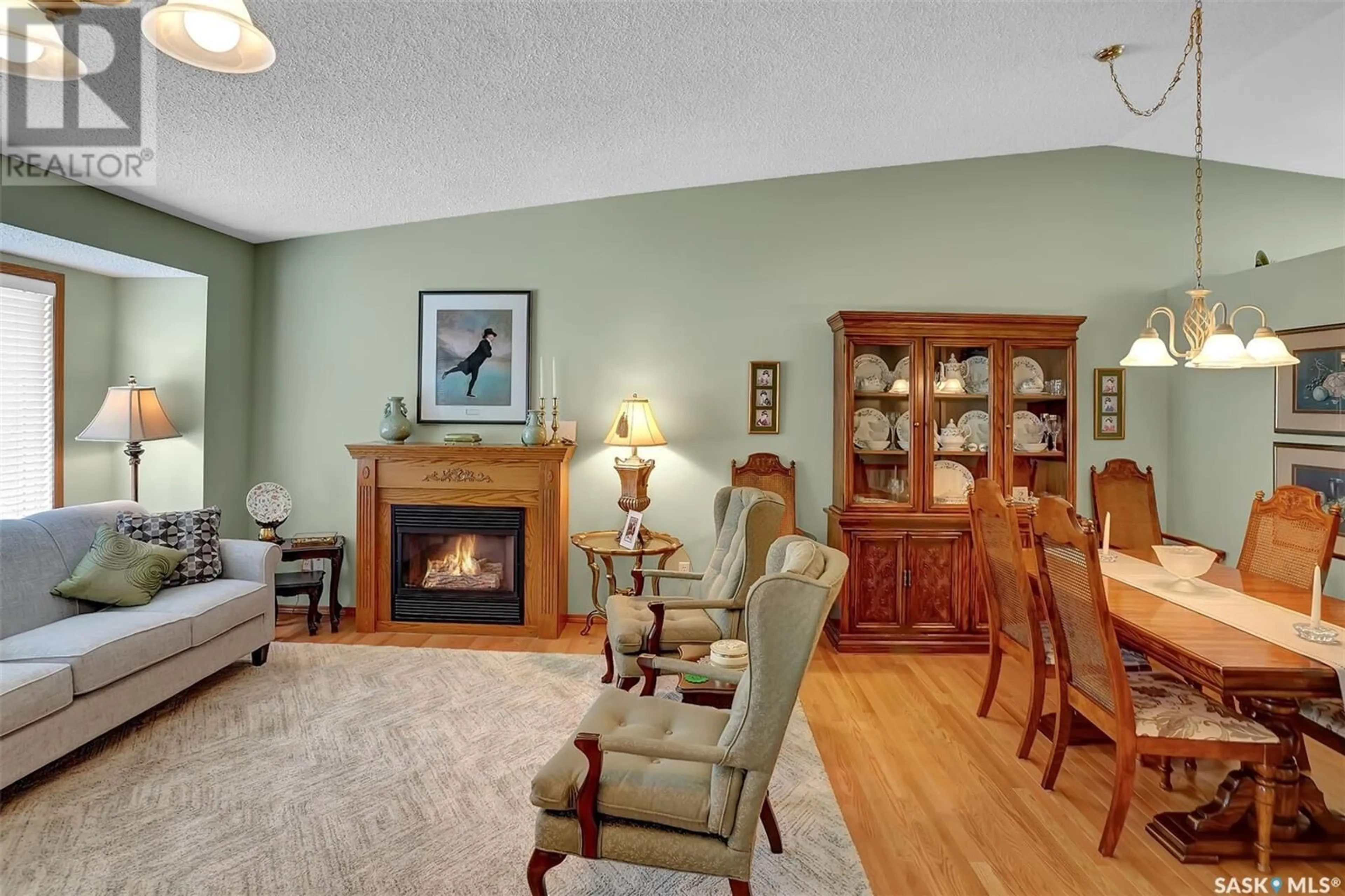 Living room with furniture, wood/laminate floor for 38 GREENSBORO DRIVE, Regina Saskatchewan S4S7G1