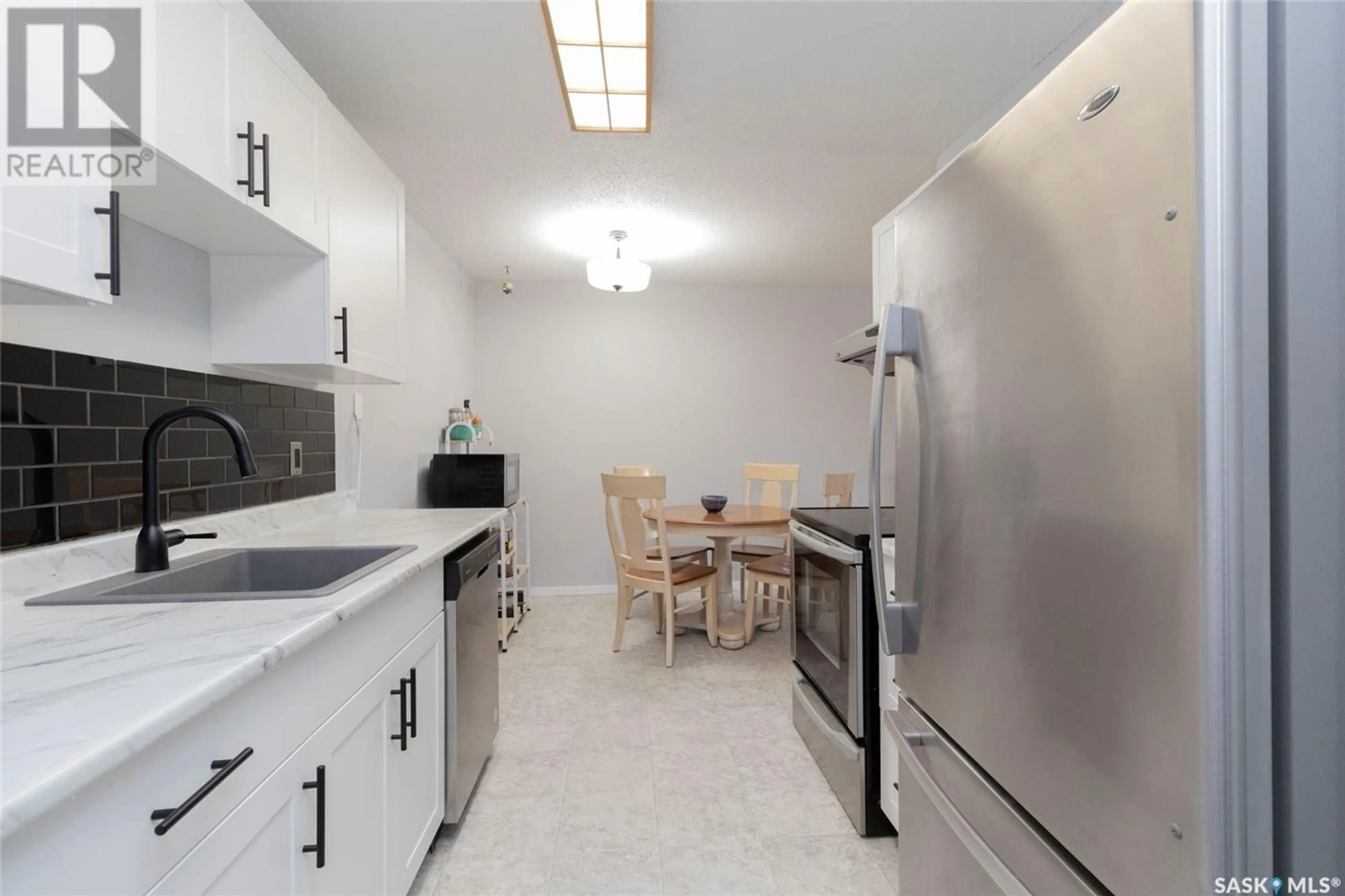 Standard kitchen, ceramic/tile floor for 310 - 625 STILLWATER DRIVE, Saskatoon Saskatchewan S7J4H7