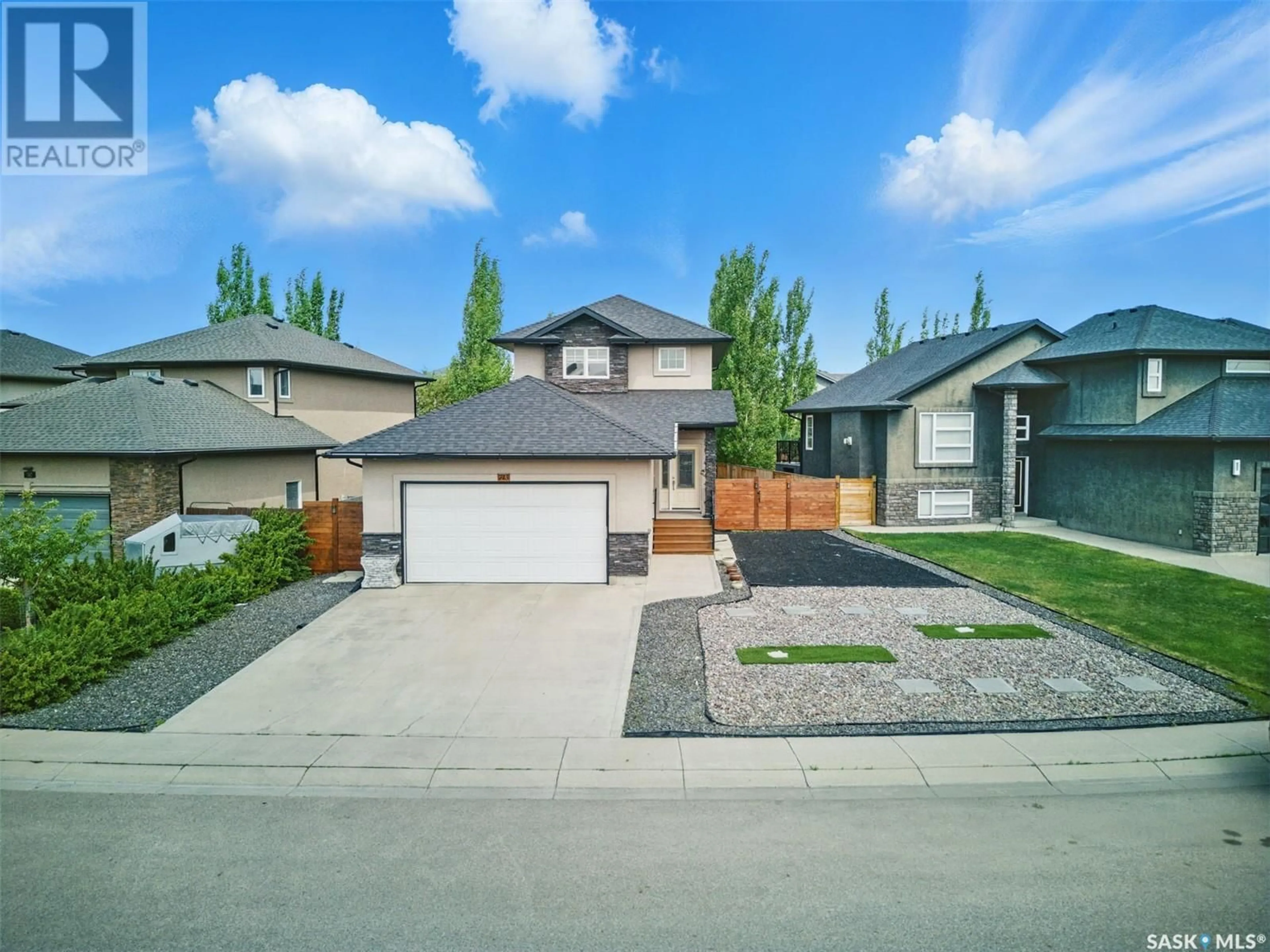 A pic from outside/outdoor area/front of a property/back of a property/a pic from drone, street for 743 SUTTER CRESCENT, Saskatoon Saskatchewan S7T0R5