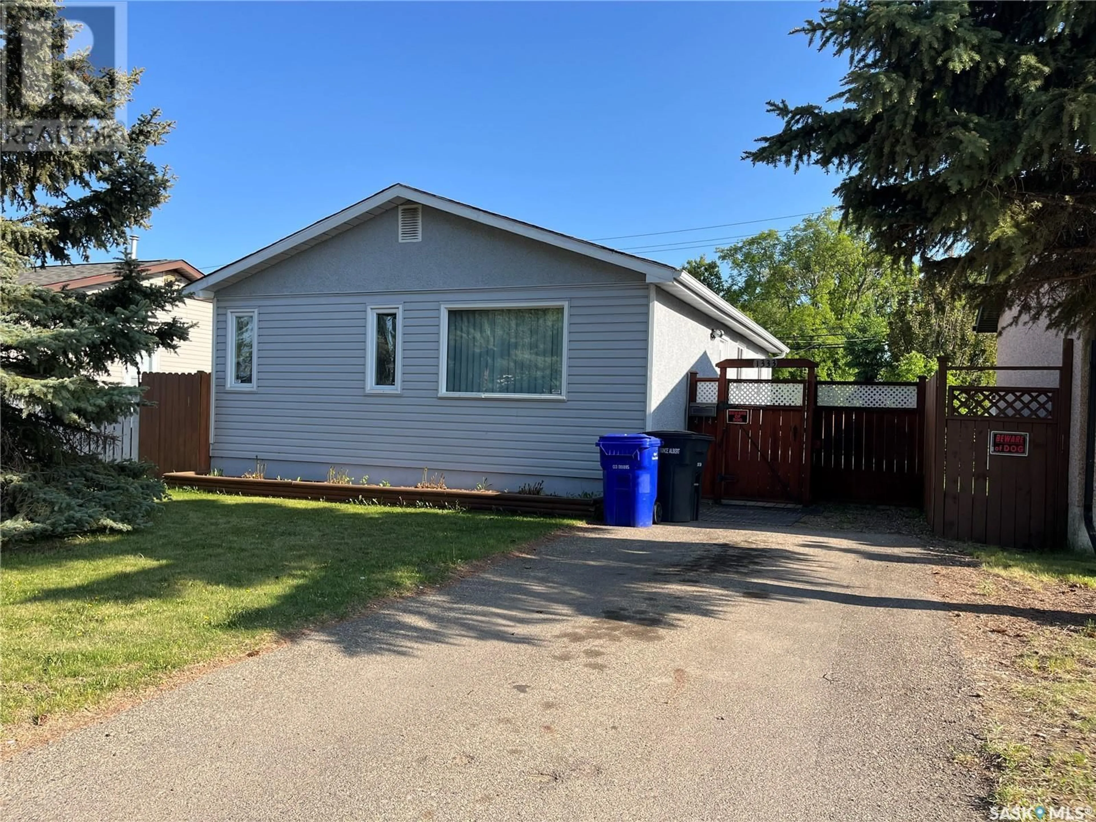 Home with vinyl exterior material, street for 1333 12TH STREET, Prince Albert Saskatchewan S6V3E6