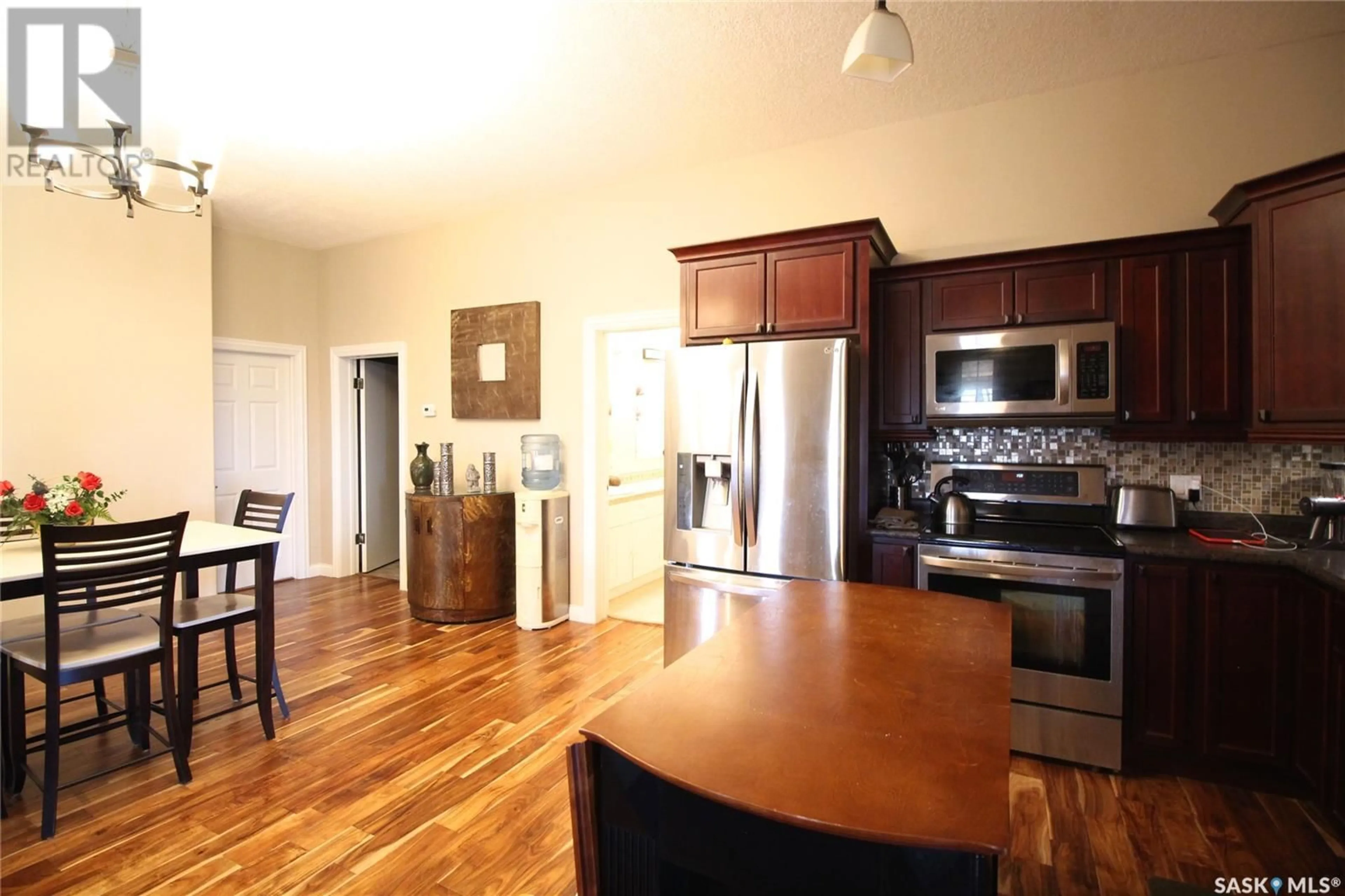 Open concept kitchen, wood/laminate floor for FRANK ACREAGE, Wawken Rm No. 93 Saskatchewan S0G2R0
