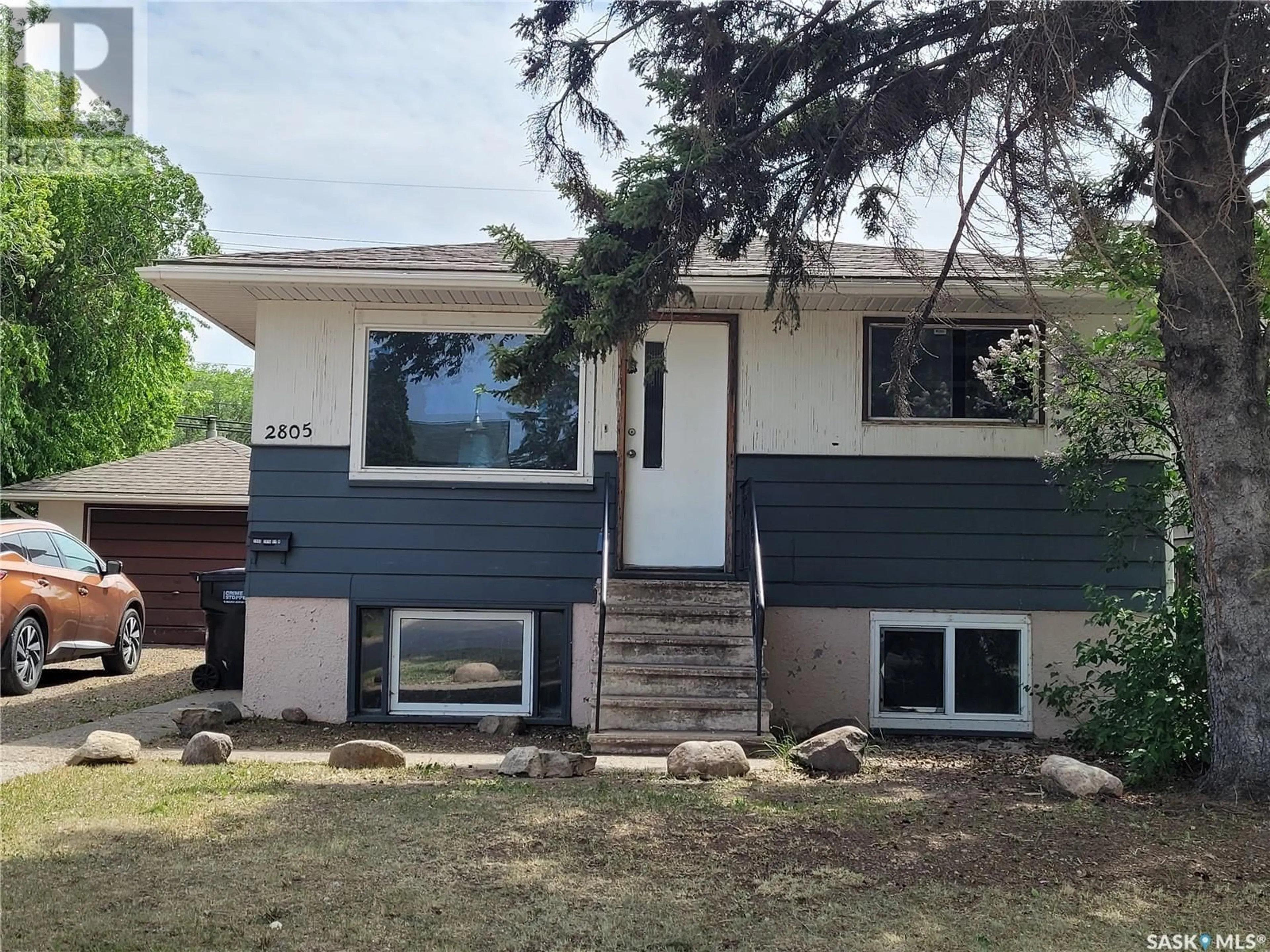 Home with vinyl exterior material, street for 2805 20TH STREET, Saskatoon Saskatchewan S7M1B9