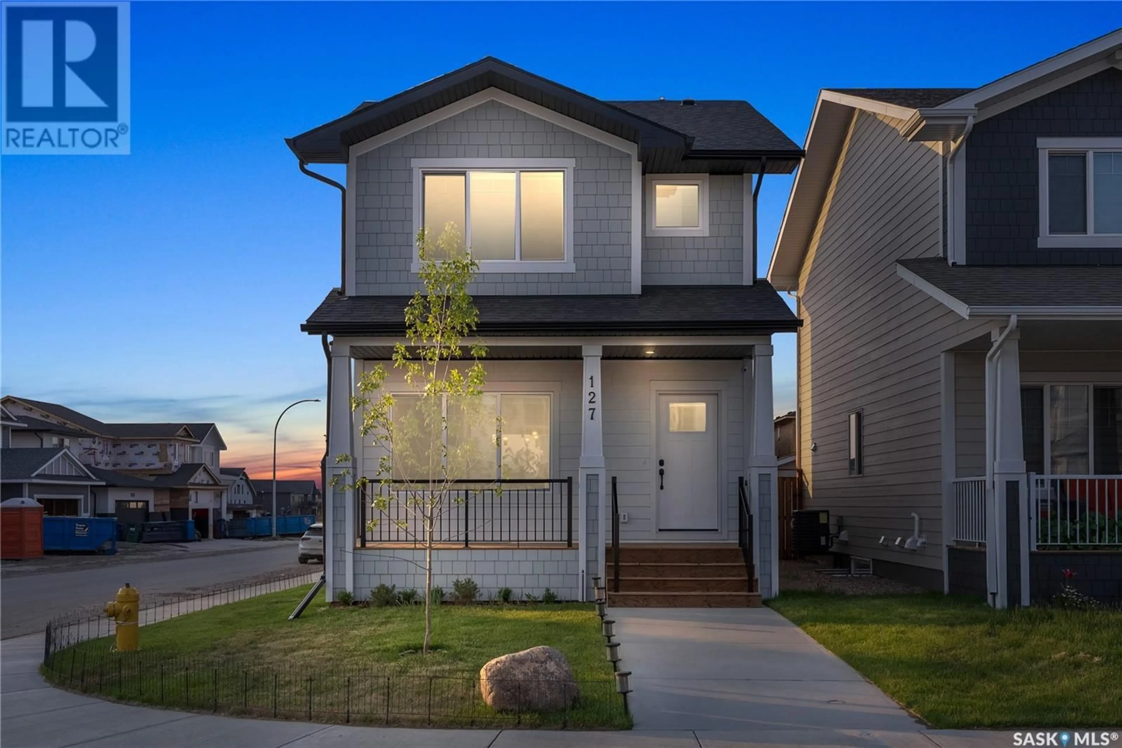 Home with vinyl exterior material, street for 127 KOSTIUK CRESCENT, Saskatoon Saskatchewan S7V1R8