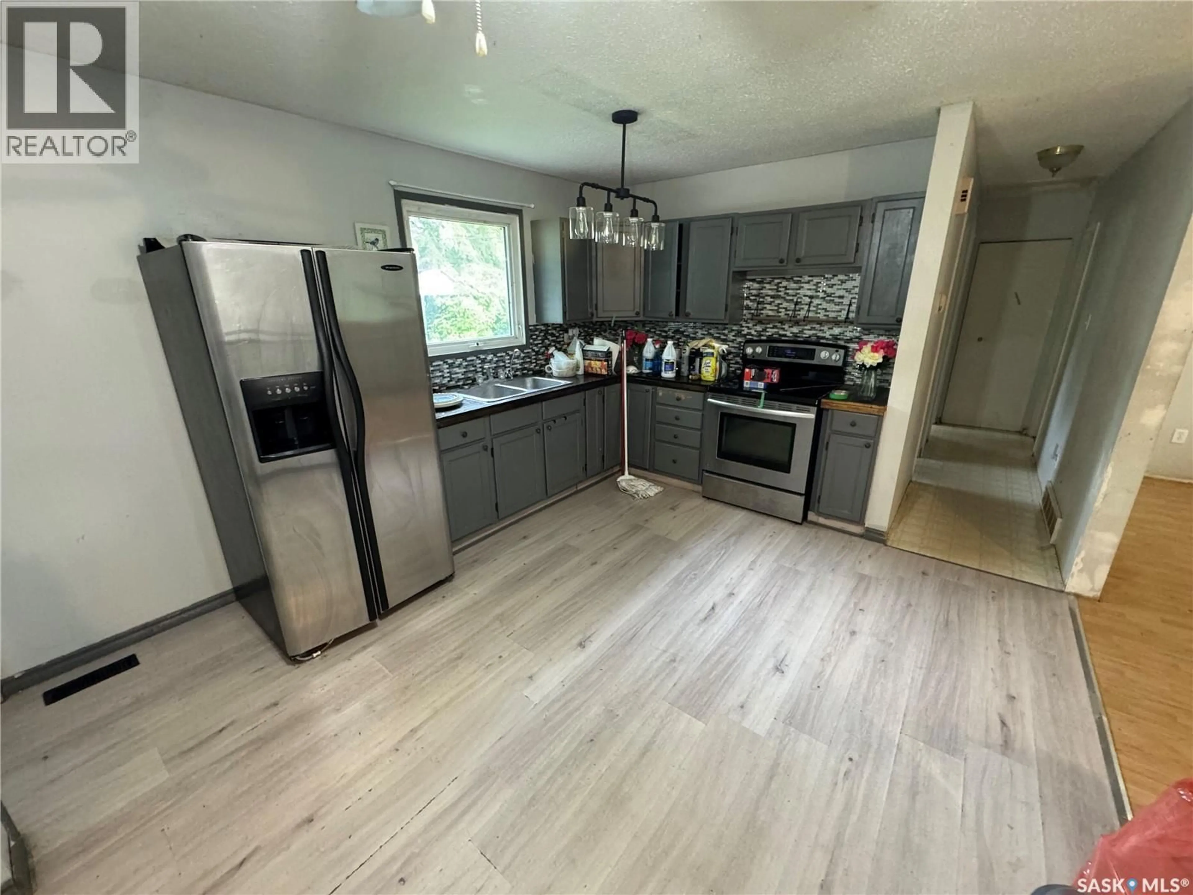 Open concept kitchen, wood/laminate floor for 414 3RD AVENUE, Naicam Saskatchewan S0K2Z0