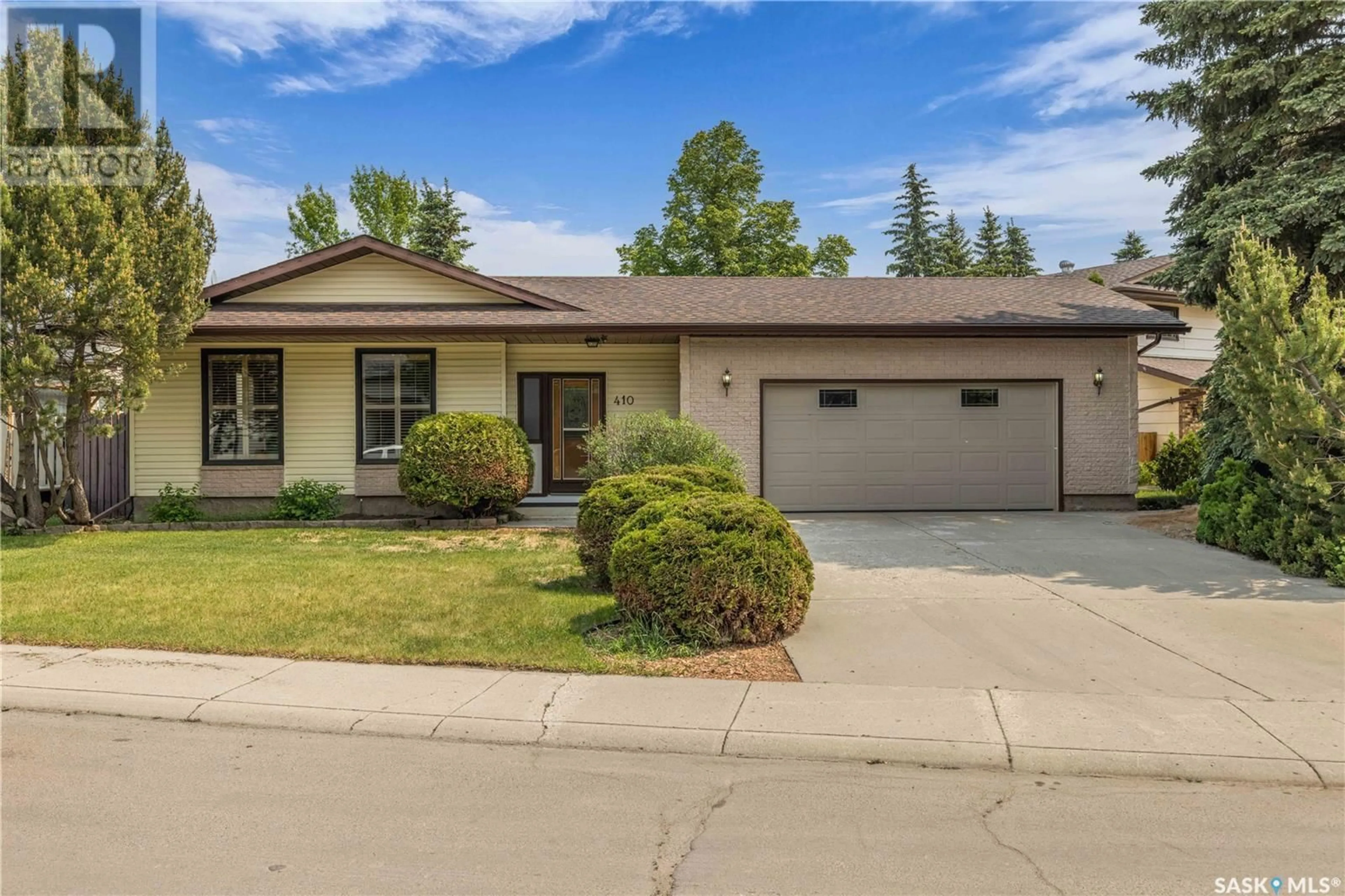 Home with brick exterior material, street for 410 AE ADAMS WAY, Saskatoon Saskatchewan S7K5N6