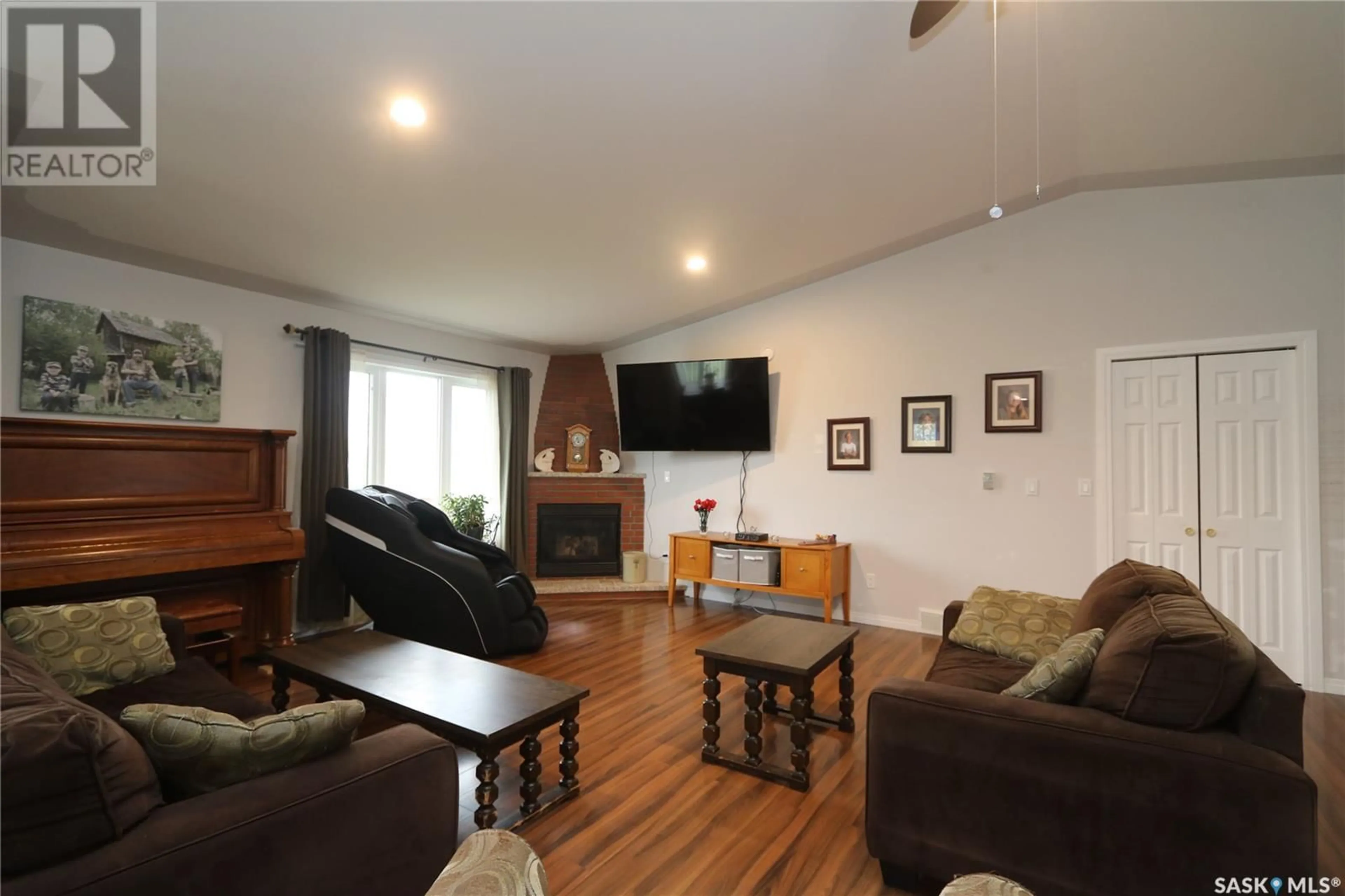 Living room with furniture, wood/laminate floor for SPRUCE LANE, Orkney Rm No. 244 Saskatchewan S3N1C1