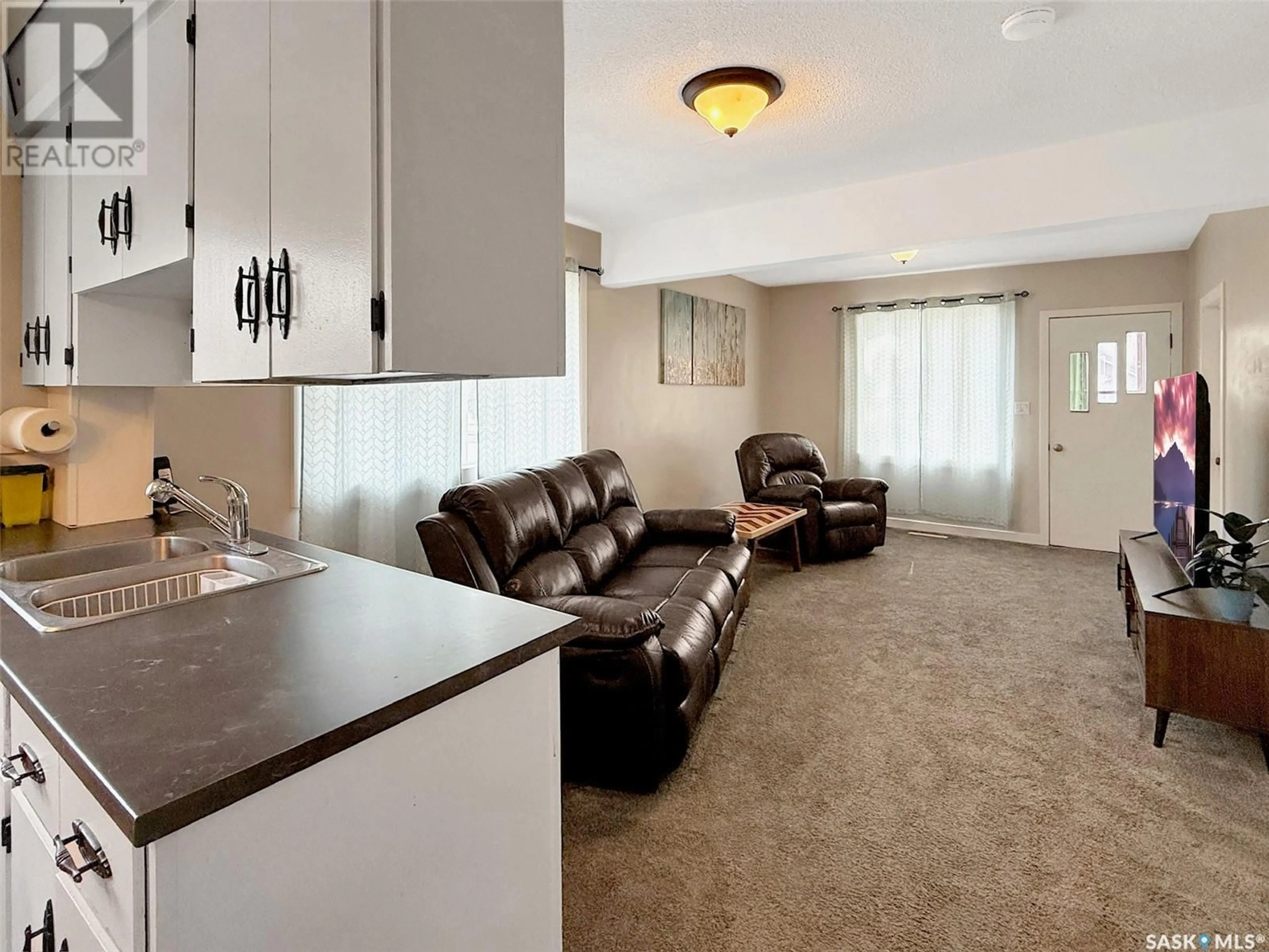 Living room with furniture, unknown for NE - 17 3RD AVENUE, Swift Current Saskatchewan S9H2G3