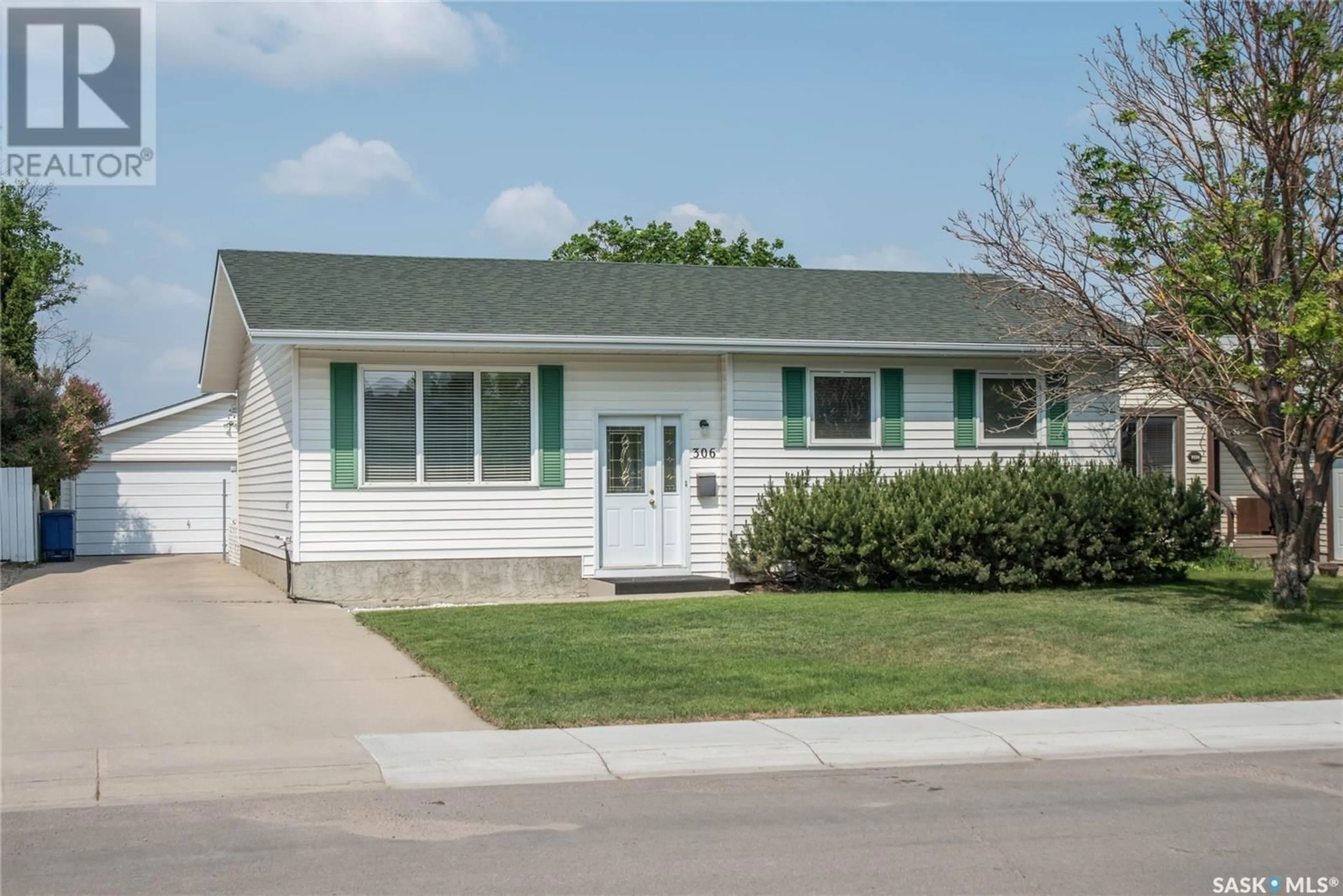Home with vinyl exterior material, street for 306 HASLAM CRESCENT, Saskatoon Saskatchewan S7S1E4