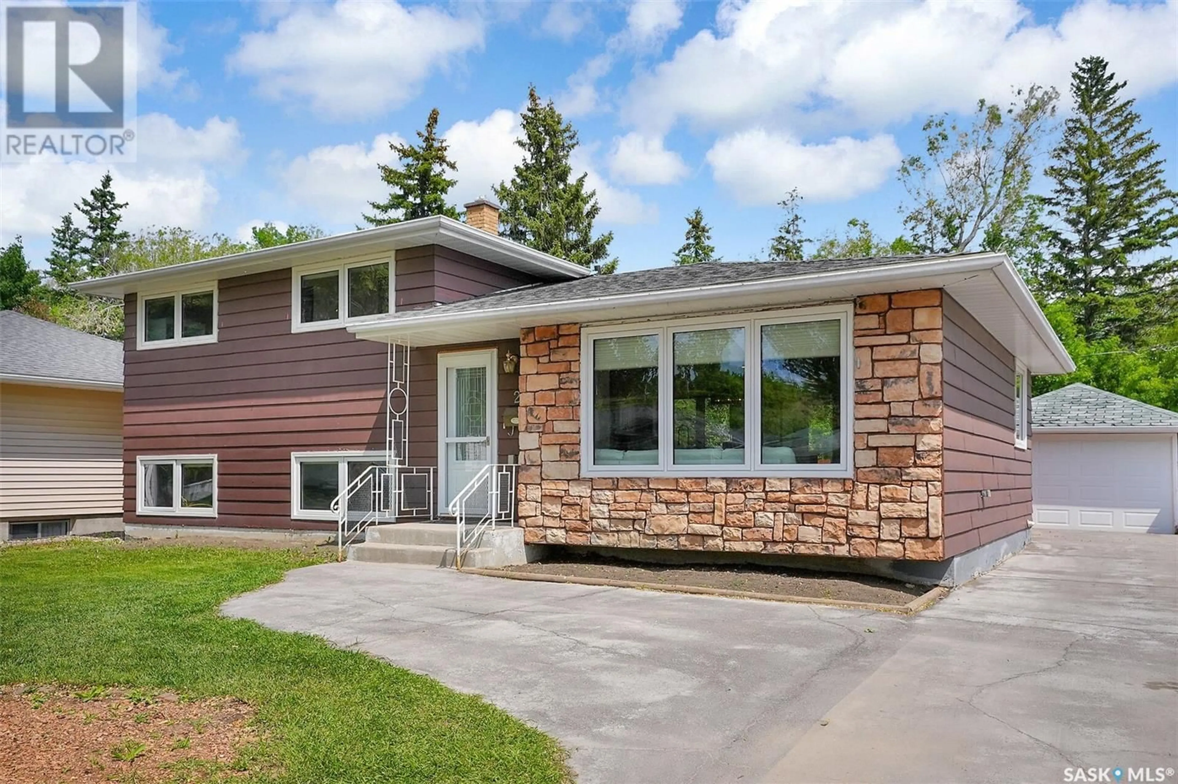 Home with vinyl exterior material, street for 25 PROBE STREET, Regina Saskatchewan S4R4V2