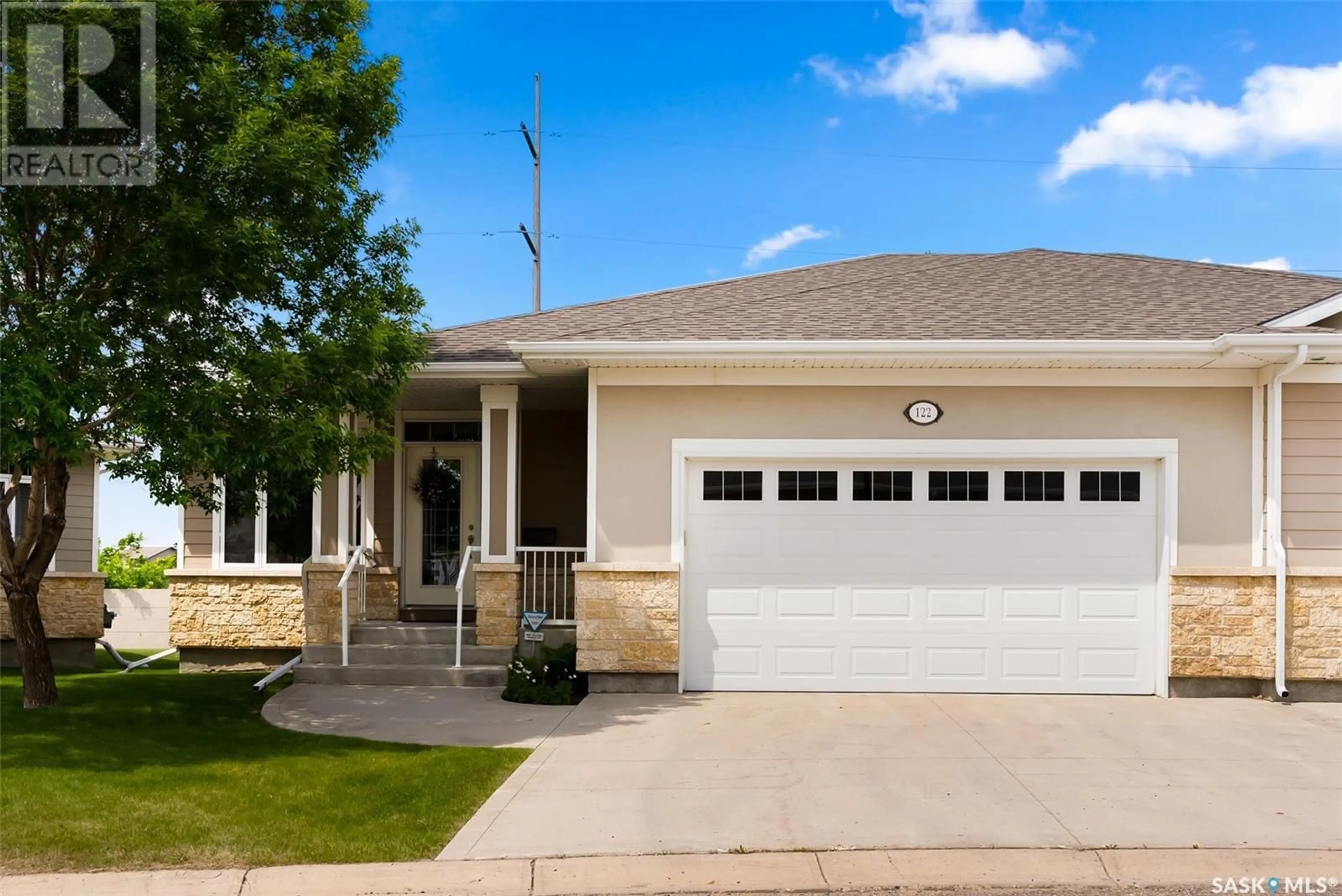 Home with vinyl exterior material, street for 122 WINTERGREENE LANE, Regina Saskatchewan S4S0A7