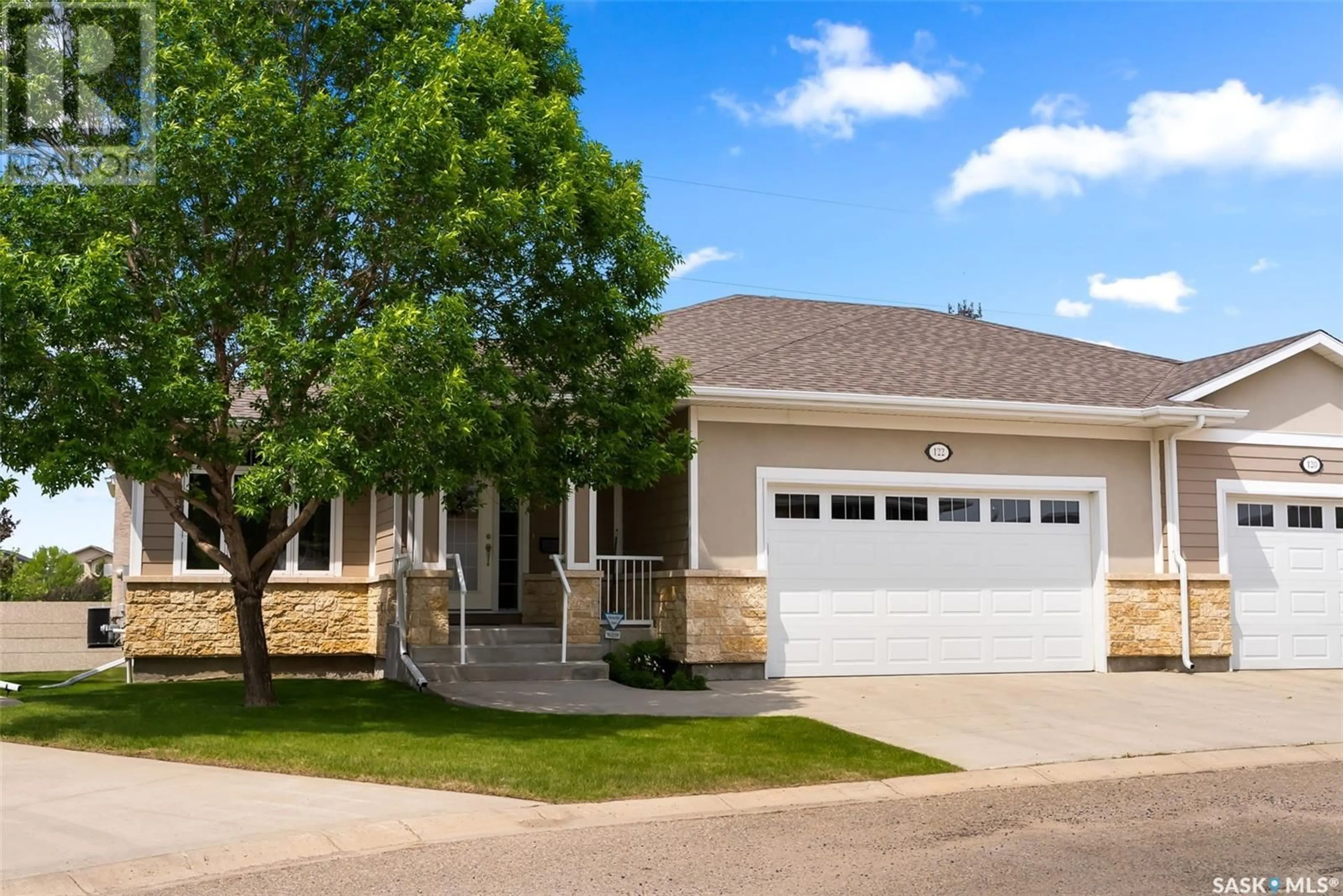 Home with vinyl exterior material, street for 122 WINTERGREENE LANE, Regina Saskatchewan S4S0A7