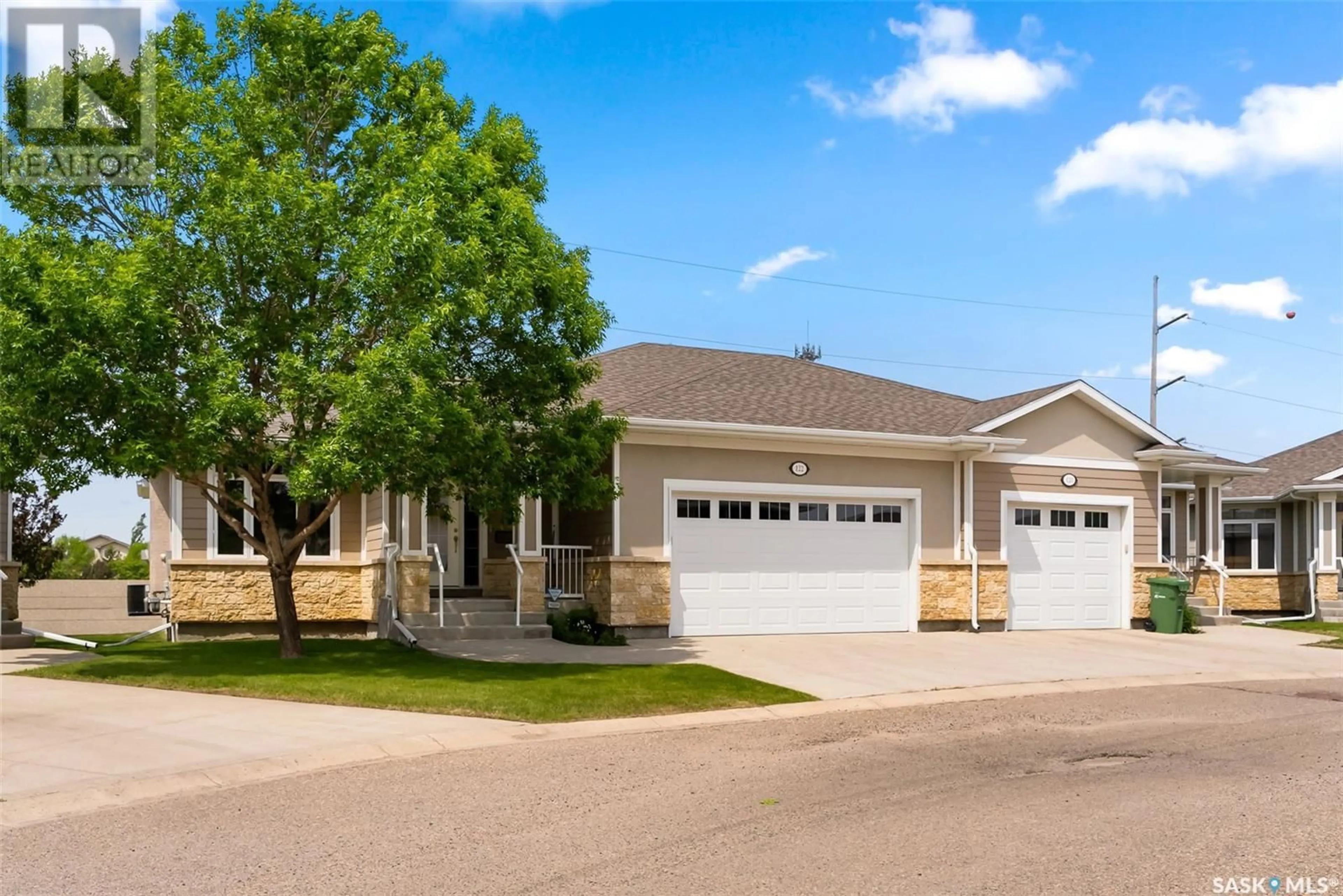 Home with vinyl exterior material, street for 122 WINTERGREENE LANE, Regina Saskatchewan S4S0A7