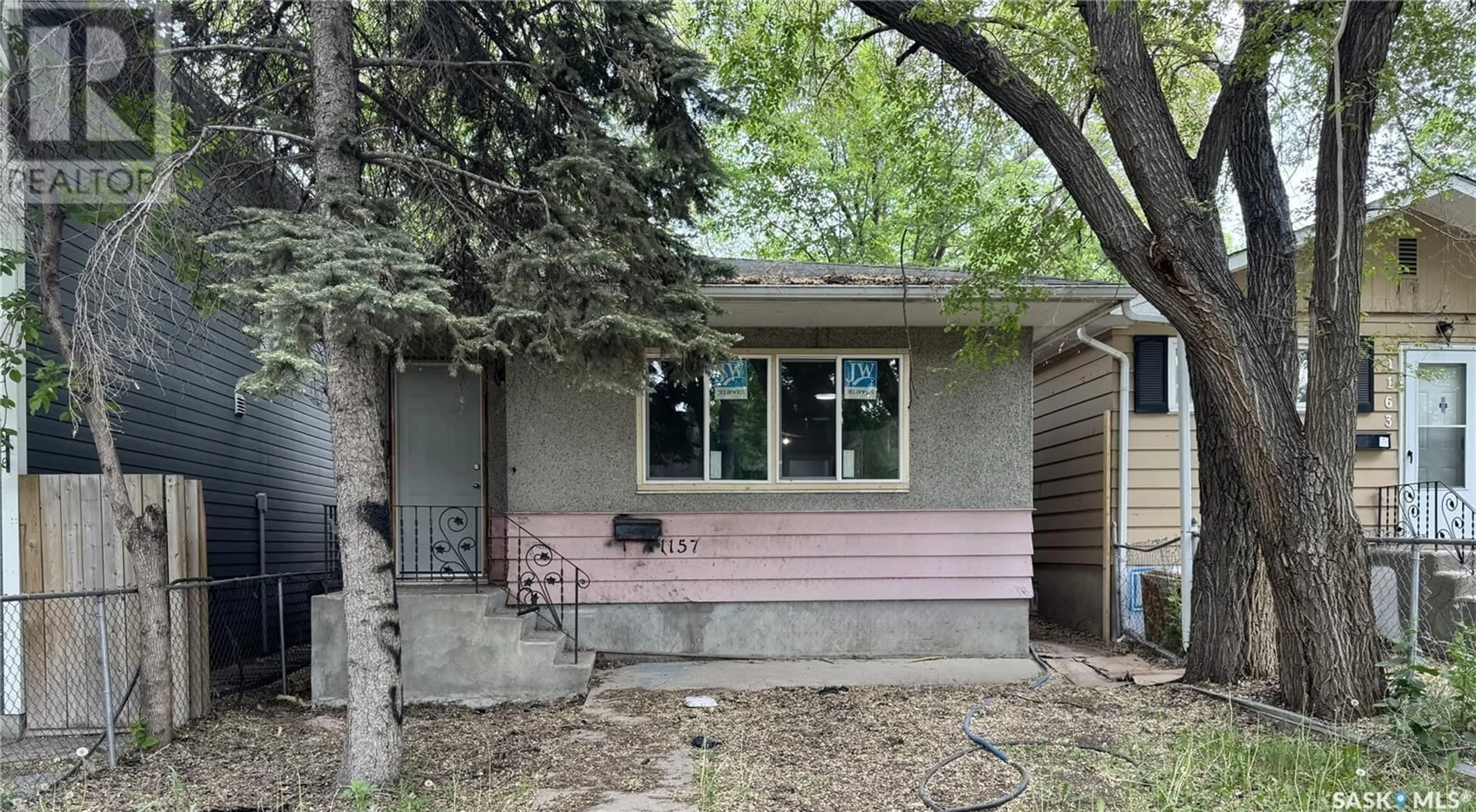 Home with vinyl exterior material, street for 1157 CAMERON STREET, Regina Saskatchewan S4T2S9