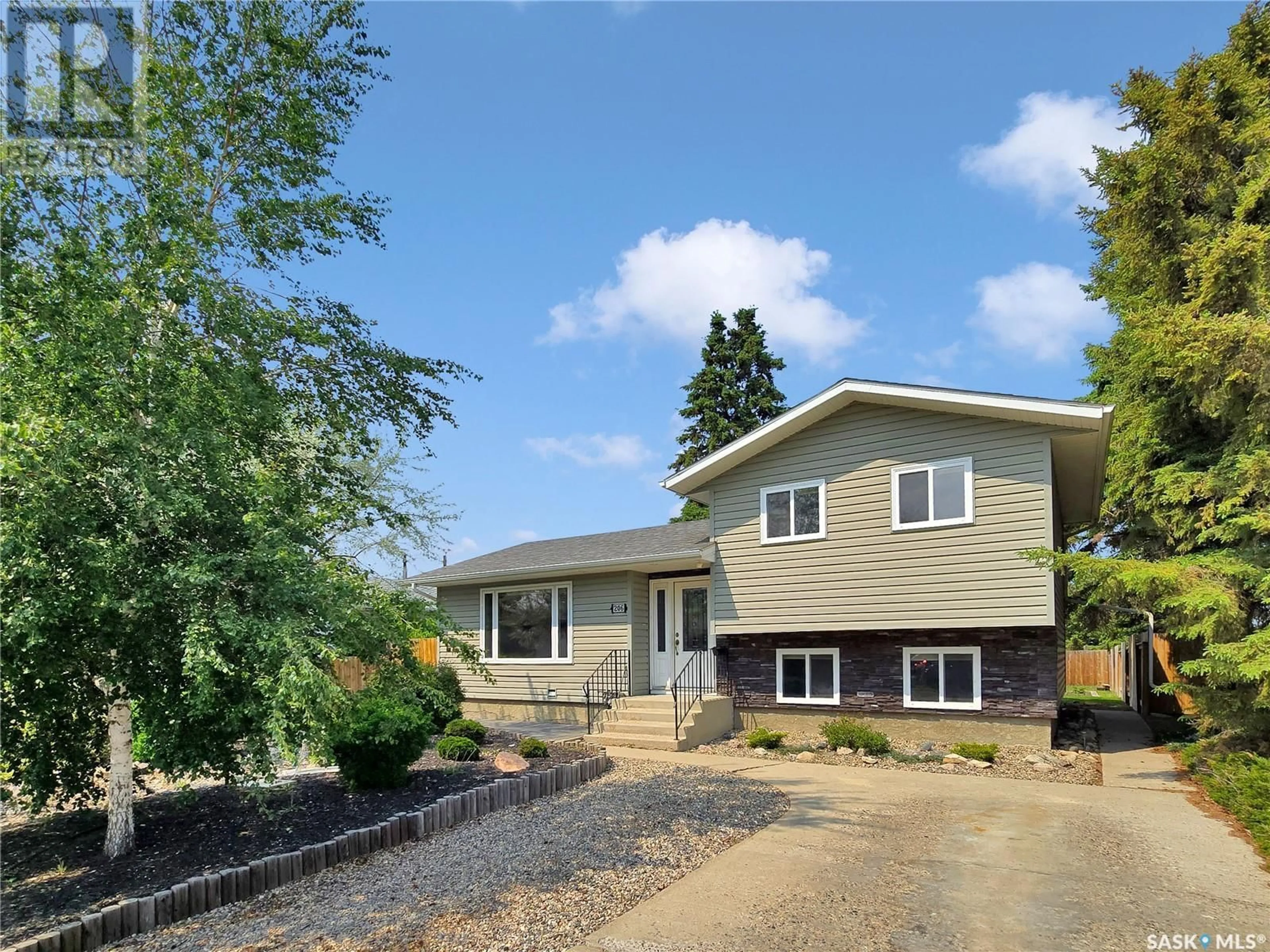 Home with vinyl exterior material, street for 206 CANORA STREET, Warman Saskatchewan S0K4S0