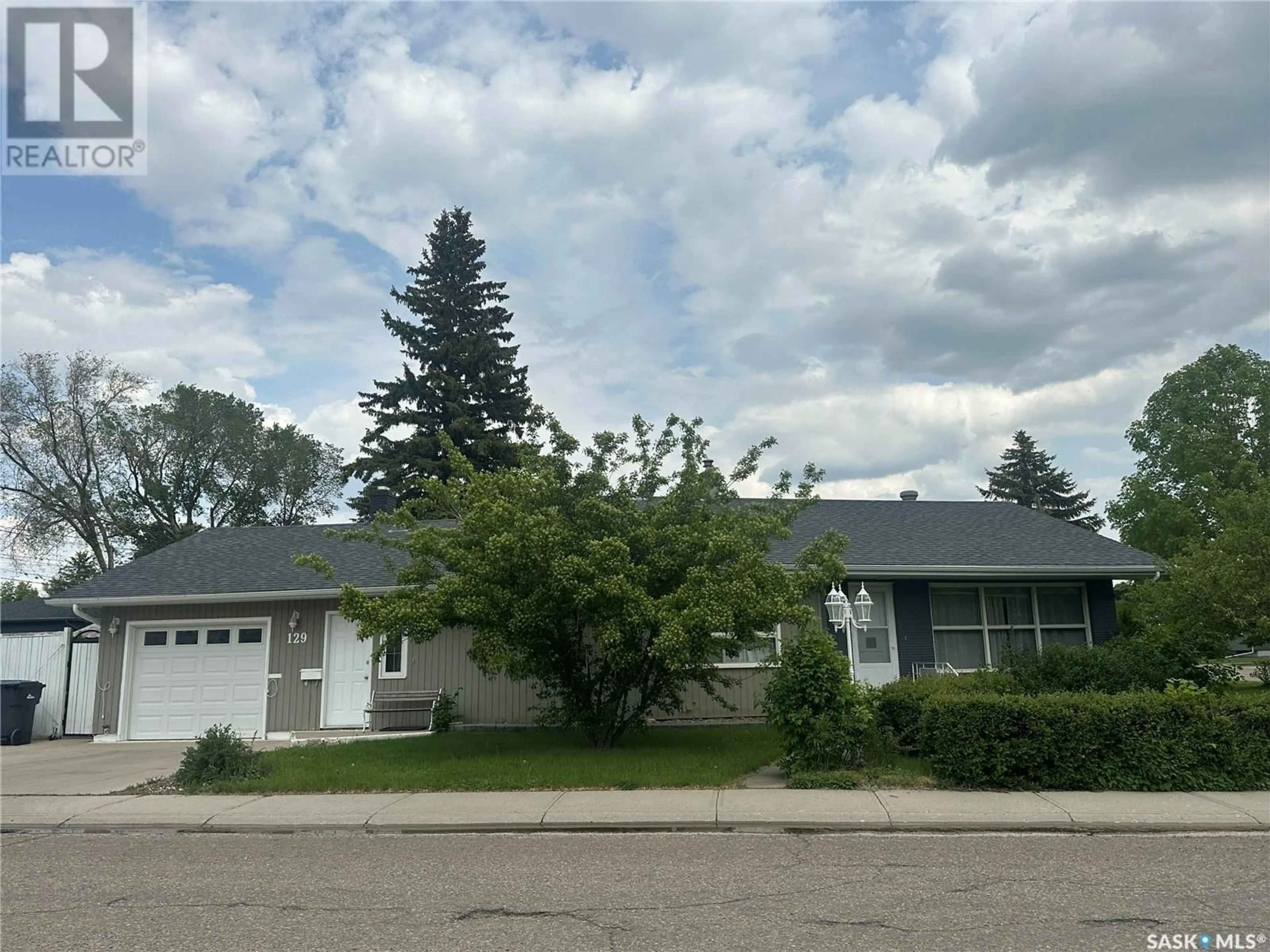 Home with vinyl exterior material, street for 129 BIRCH DRIVE, Weyburn Saskatchewan S4H0S6