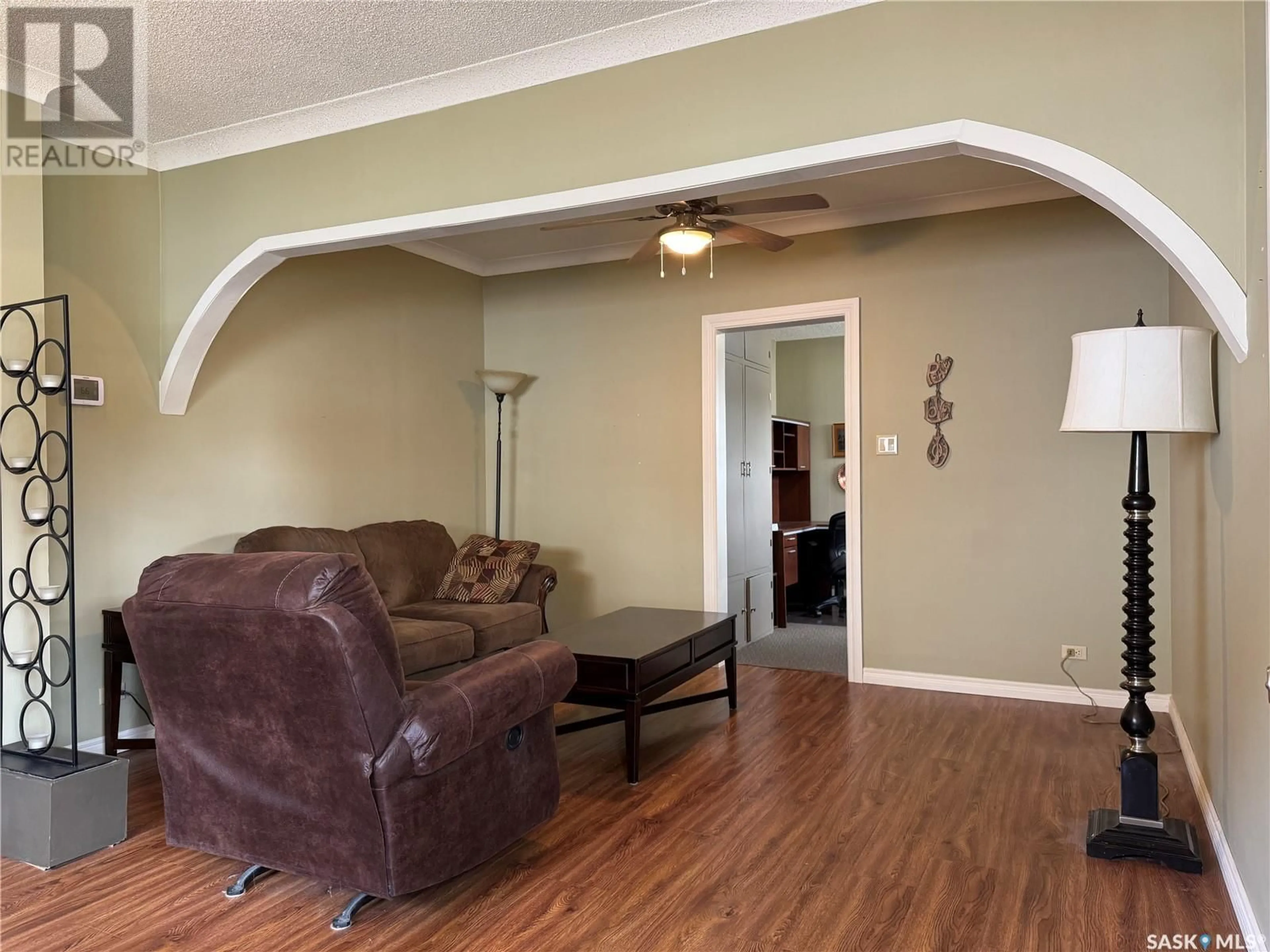Living room with furniture, wood/laminate floor for 309 ROYAL STREET, Foam Lake Saskatchewan S0A4T0