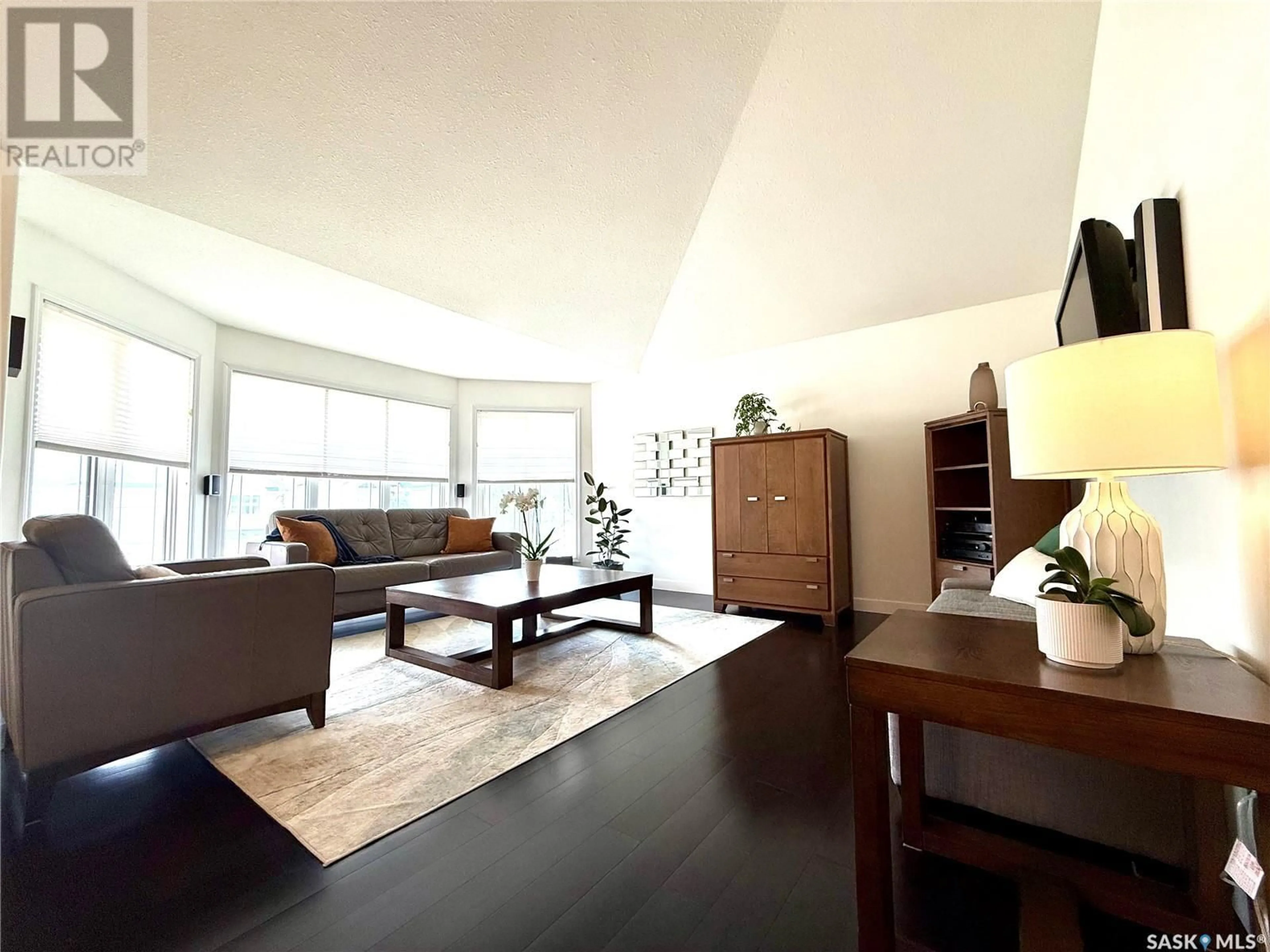 Living room with furniture, wood/laminate floor for 89 CALDWELL DRIVE, Yorkton Saskatchewan S3N4A5