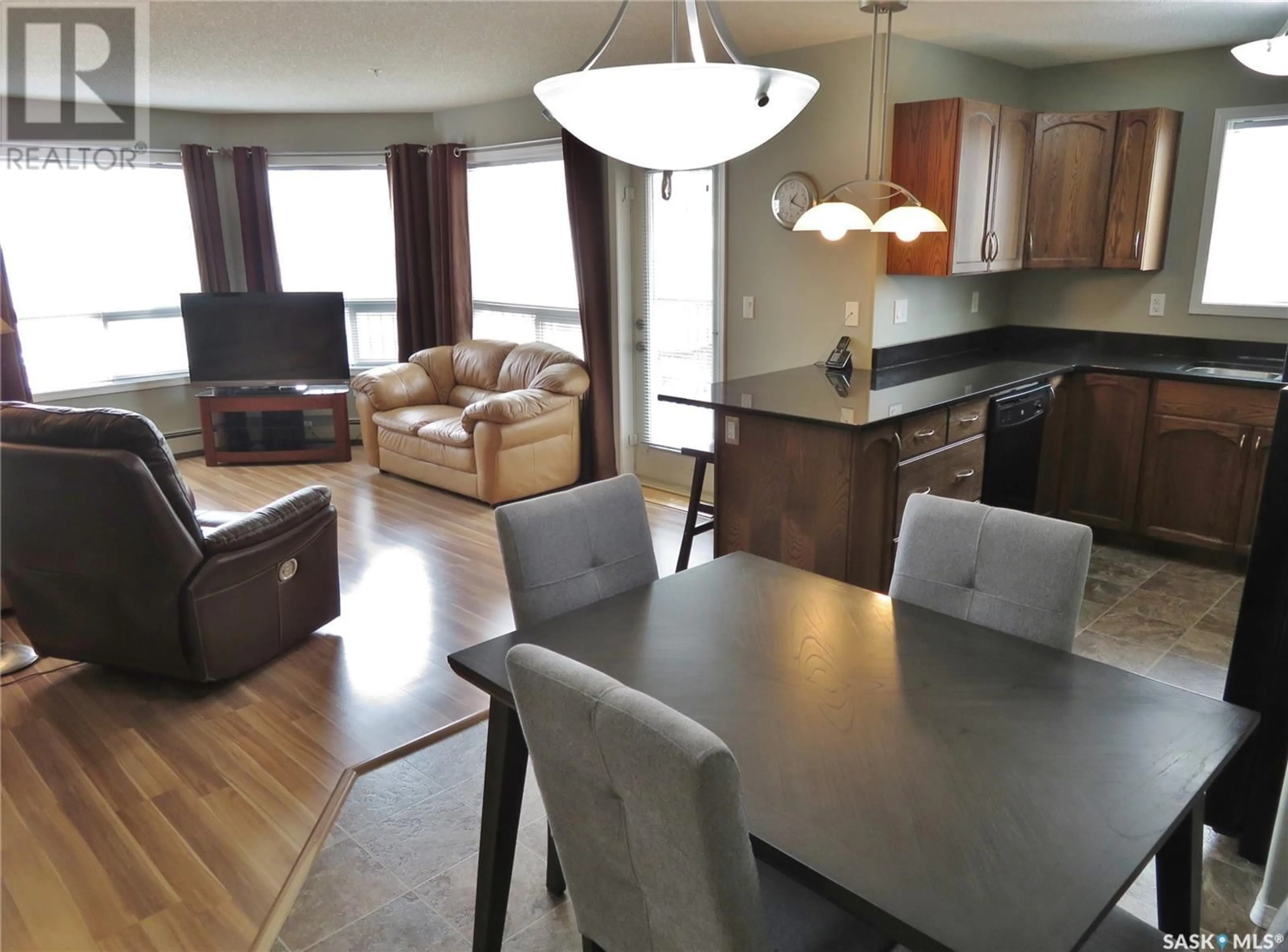 Open concept kitchen, wood/laminate floor for 150 - 316 PAWLYCHENKO LANE, Saskatoon Saskatchewan S7V0B4