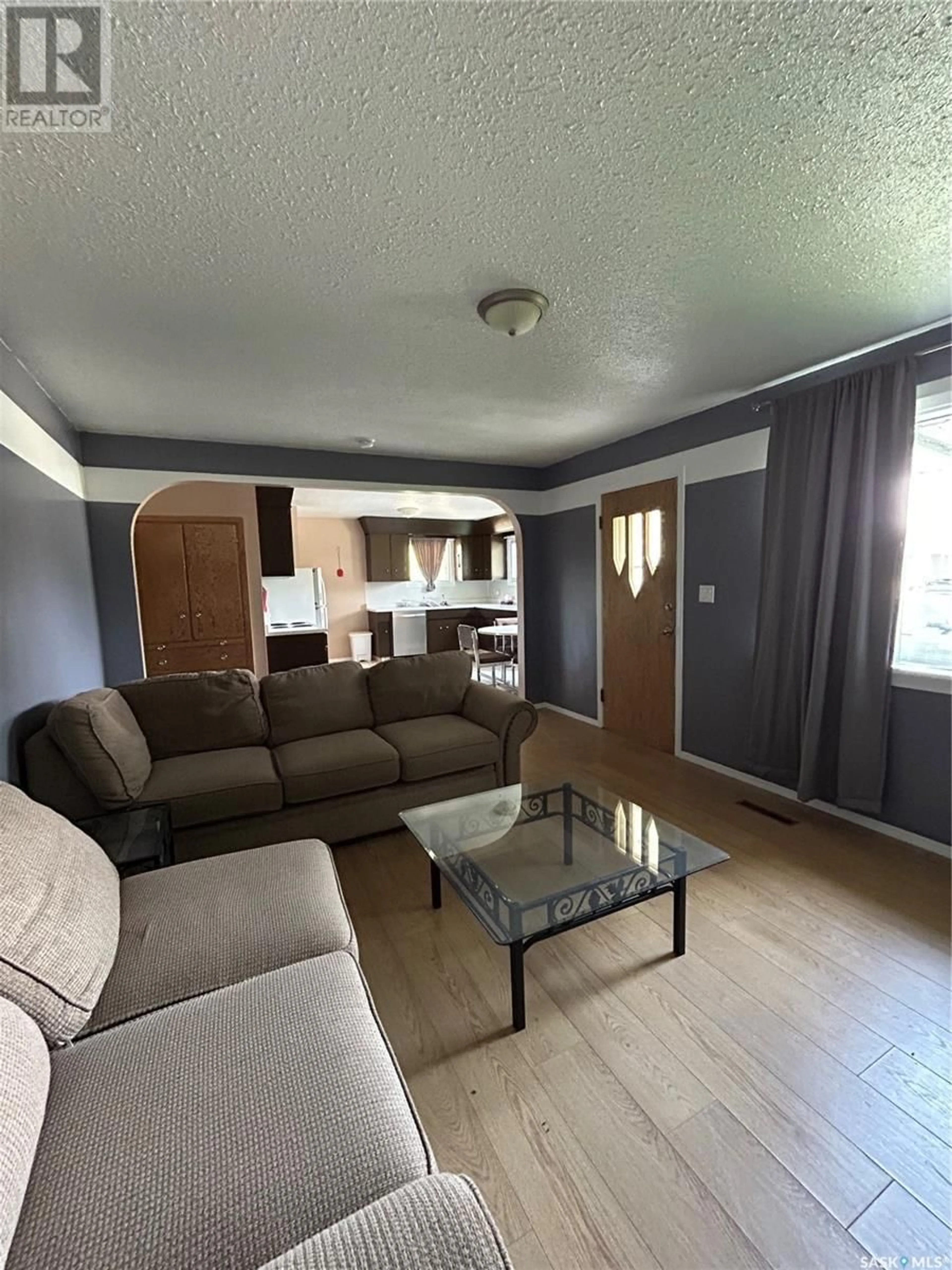 Living room with furniture, wood/laminate floor for 147 MAIN STREET, Creelman Saskatchewan S0G0X0