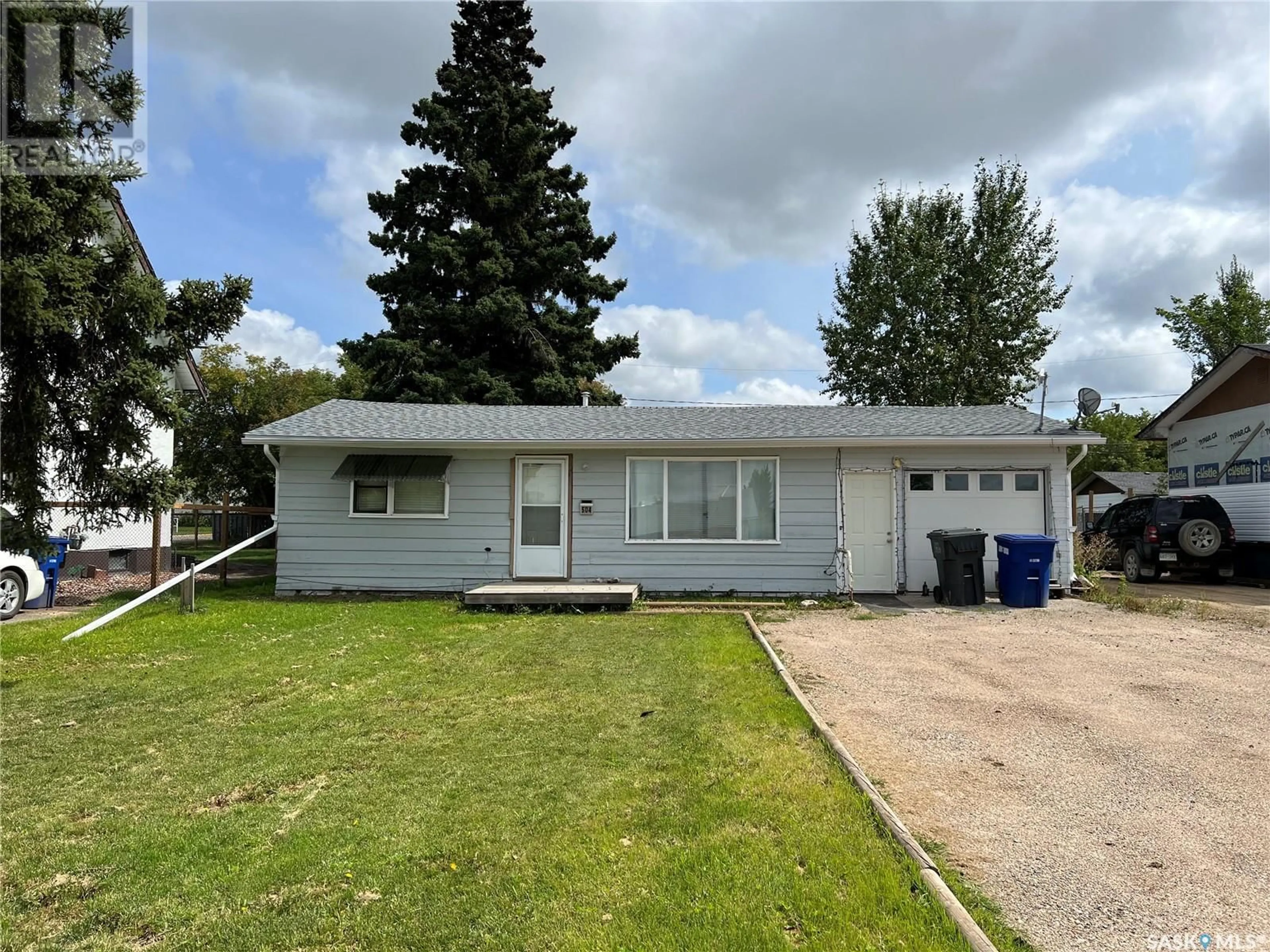 Home with vinyl exterior material, street for 504 3RD STREET, Meadow Lake Saskatchewan S9X1C9