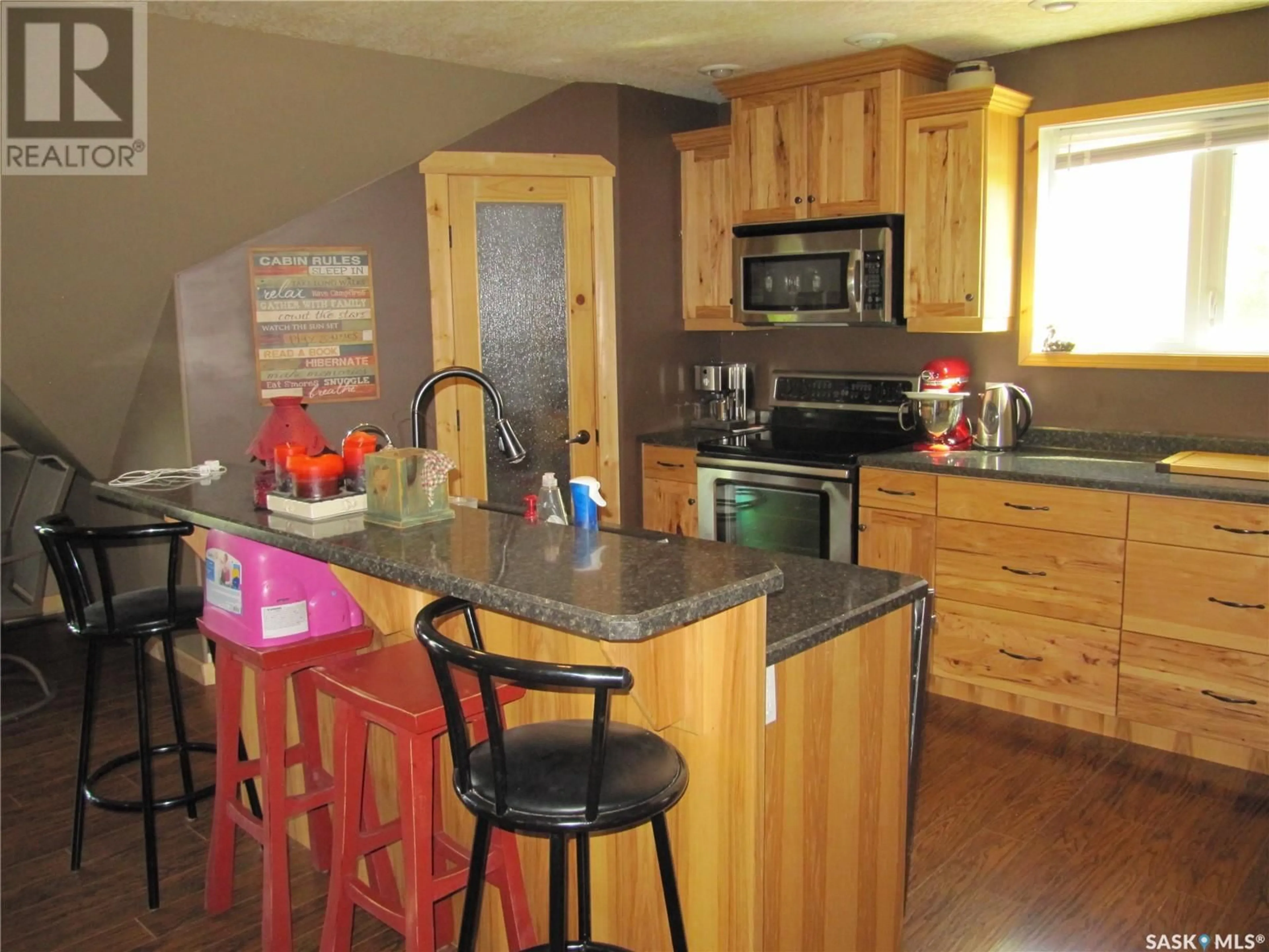 Open concept kitchen, wood/laminate floor for 533 DUSTIN PLACE, Mervin Rm No.499 Saskatchewan S0M1J0