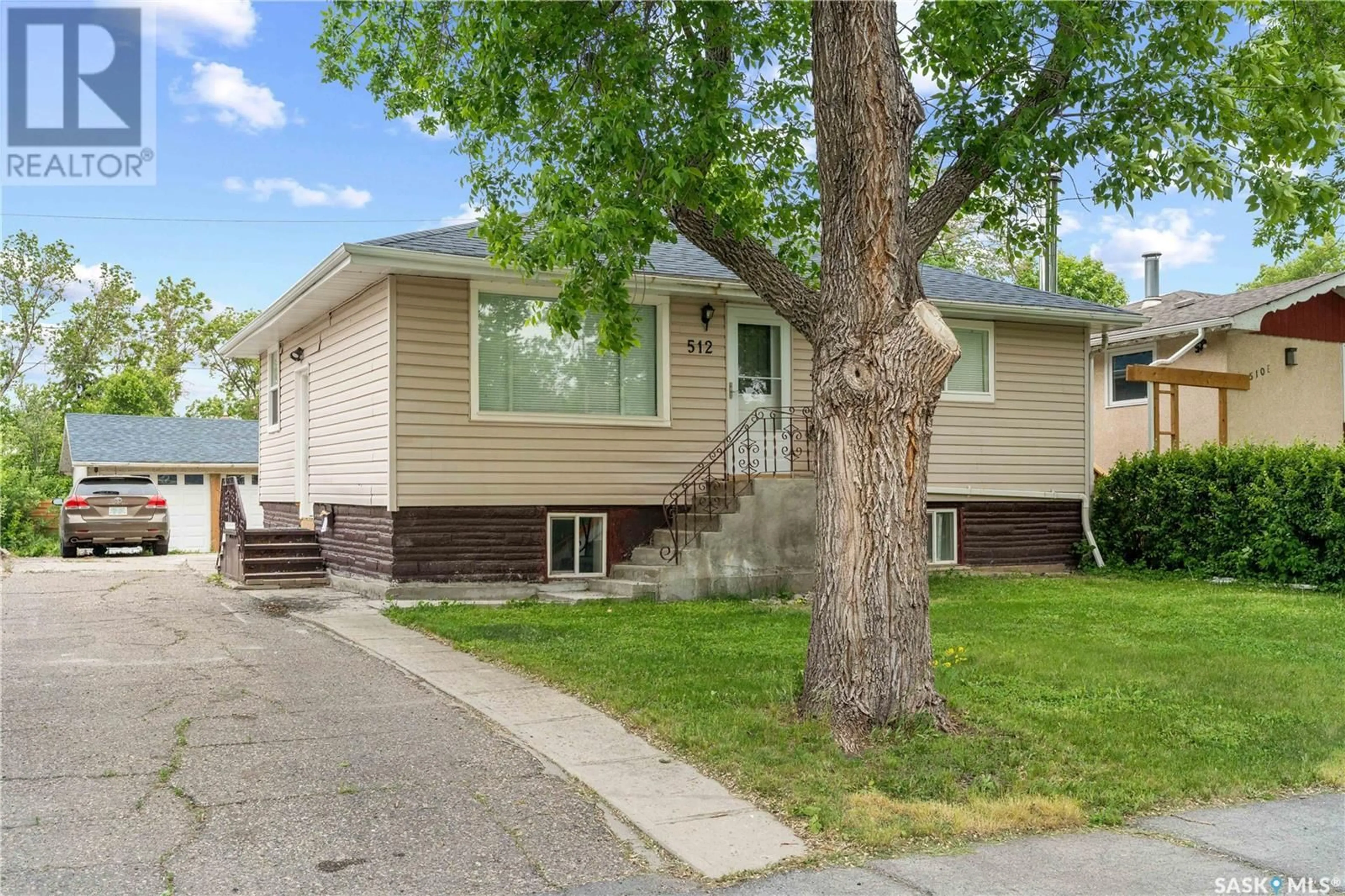Home with vinyl exterior material, street for E - 512 18TH AVENUE, Regina Saskatchewan S4N1E4